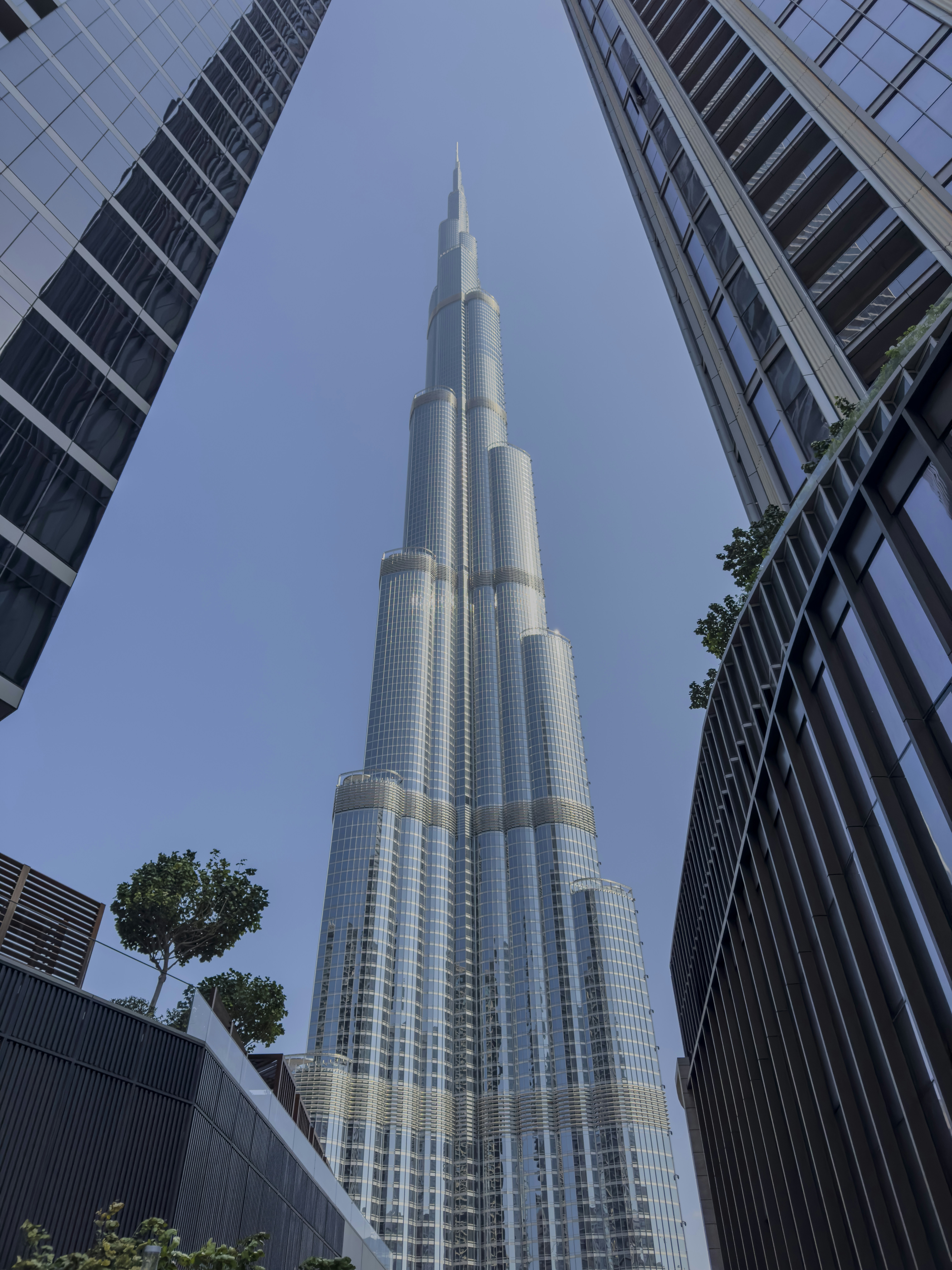The burj khalifa towers over other buildings.