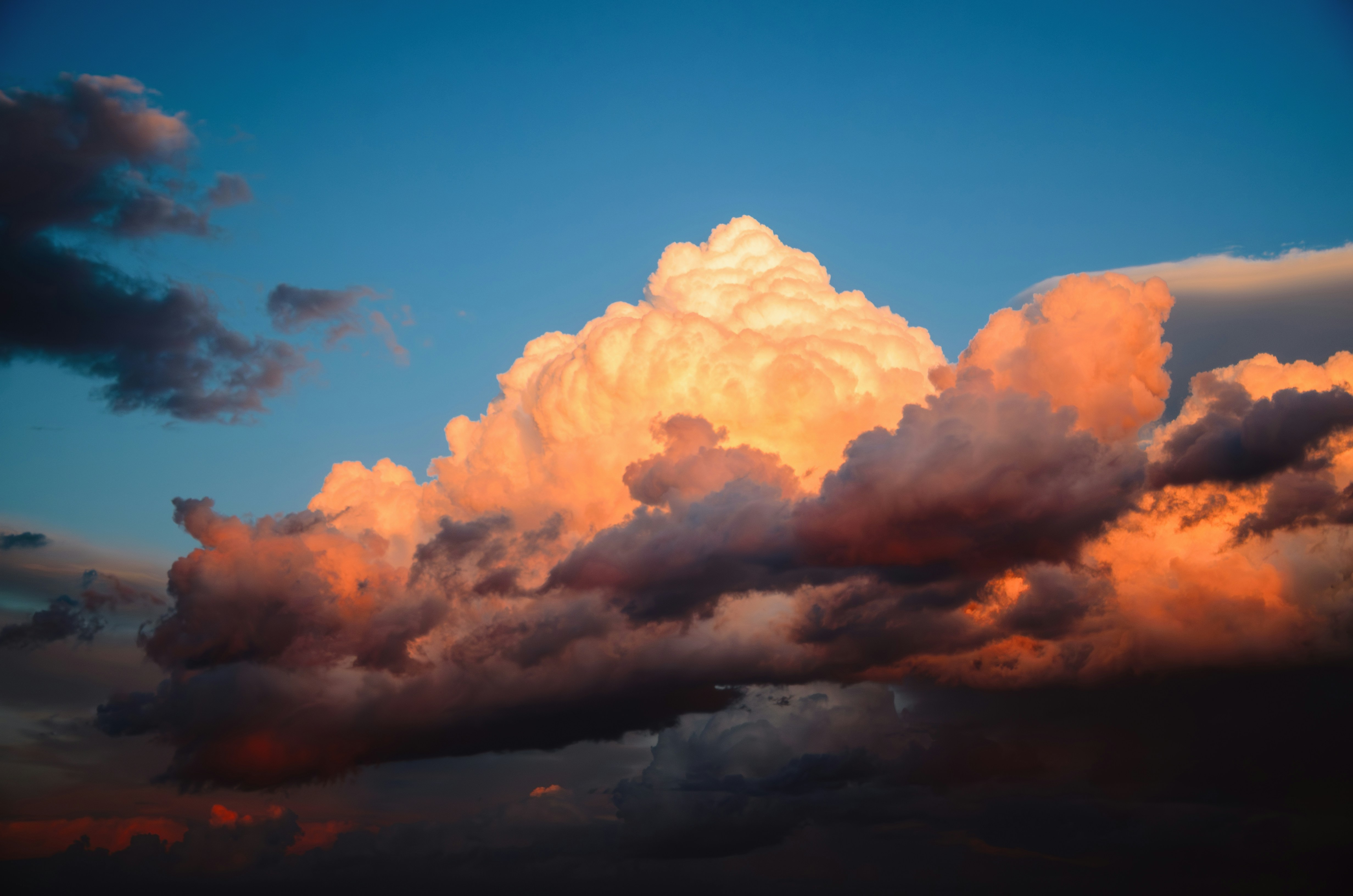 Vibrant clouds glow in the colorful sky.