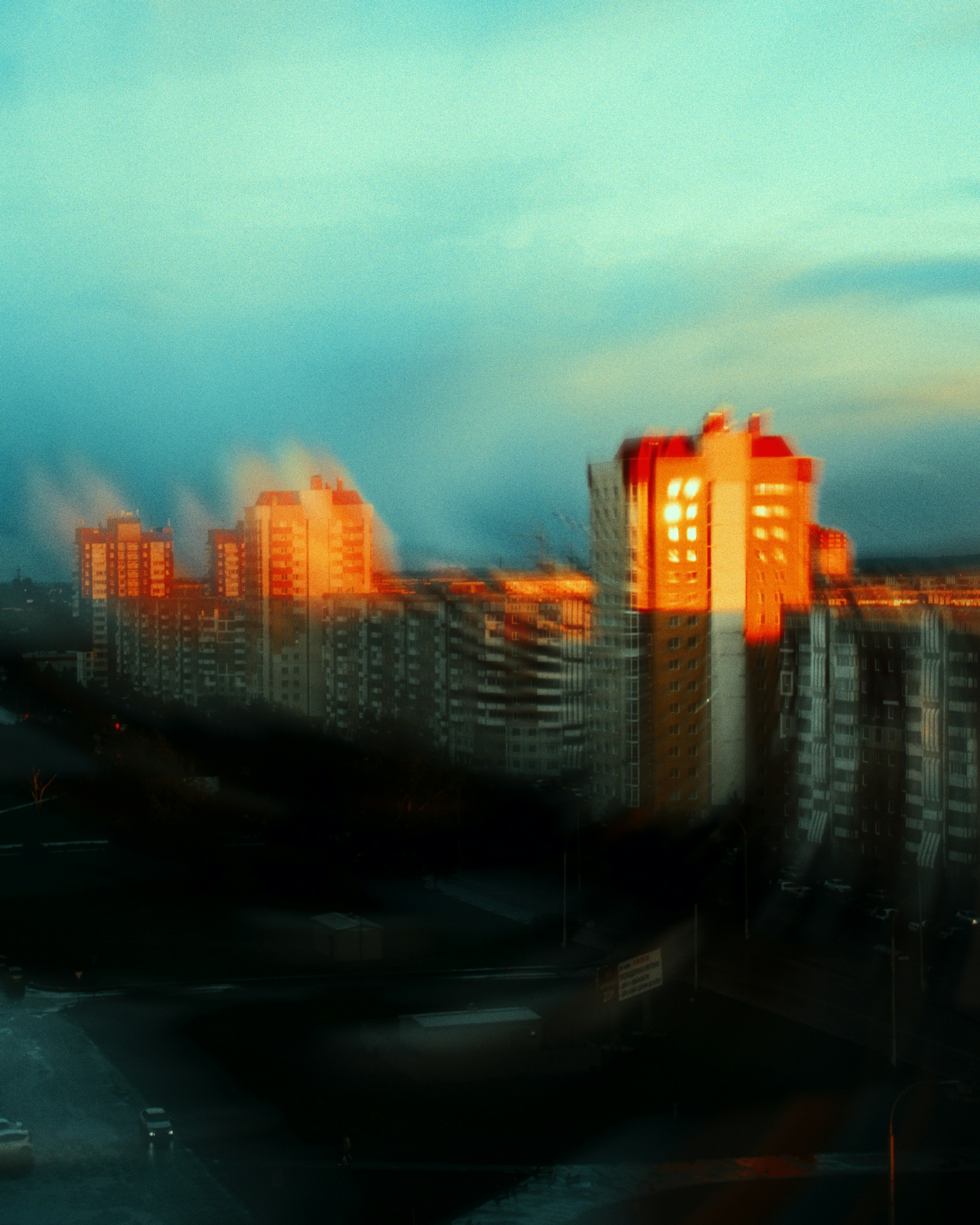 Buildings bathed in golden, sunset light.