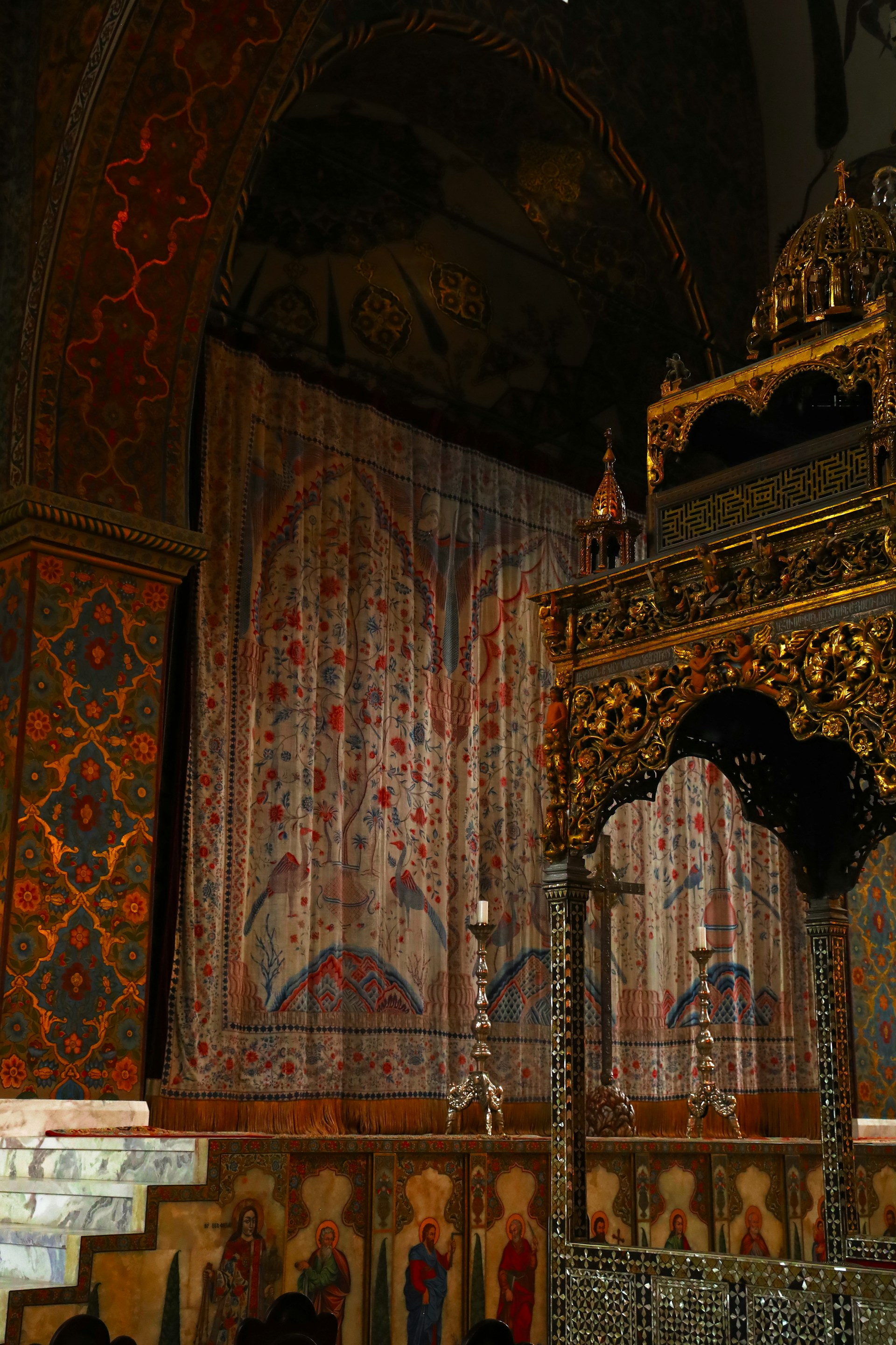 An ornate interior shows decorative details.