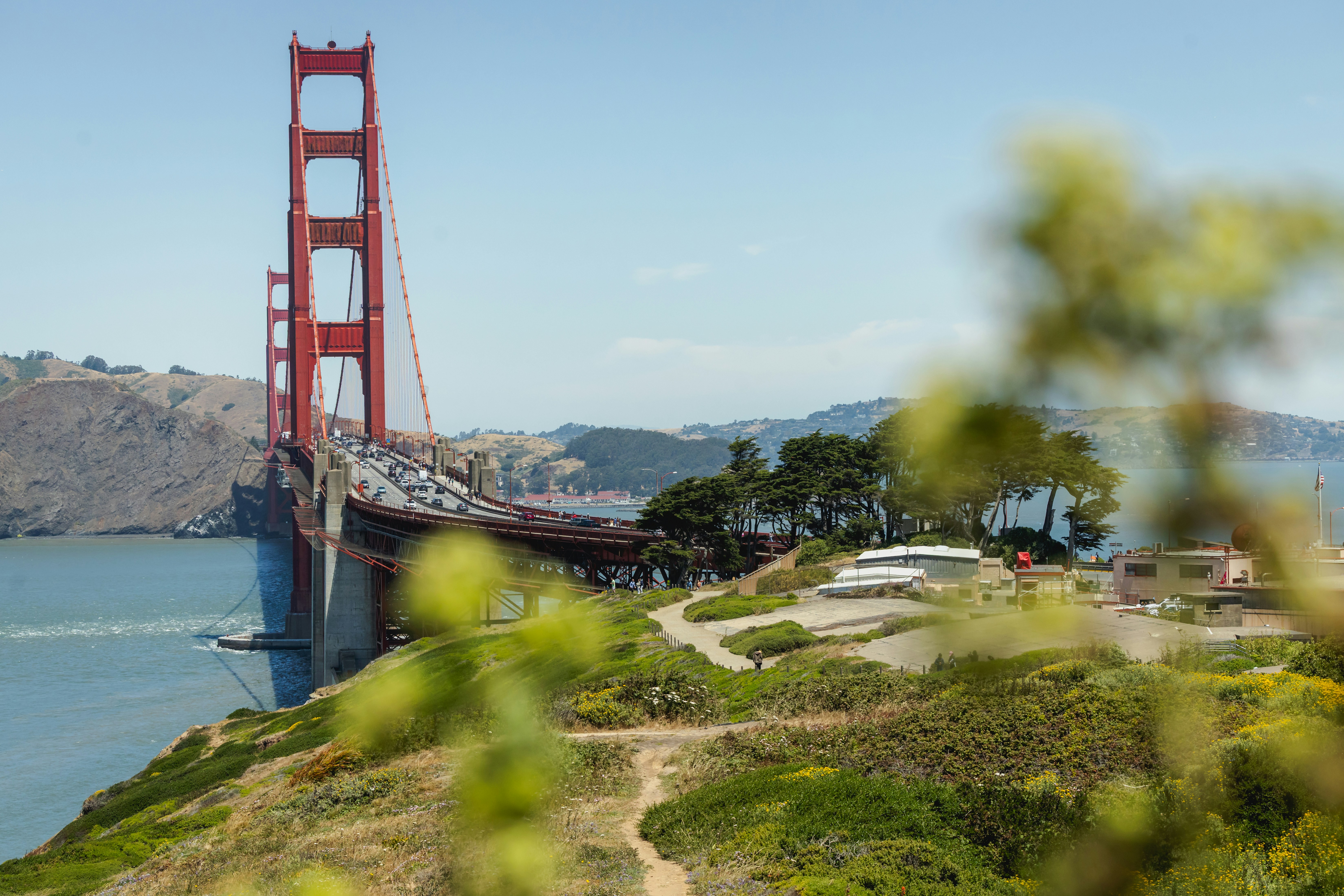 The golden gate bridge towers over the landscape.