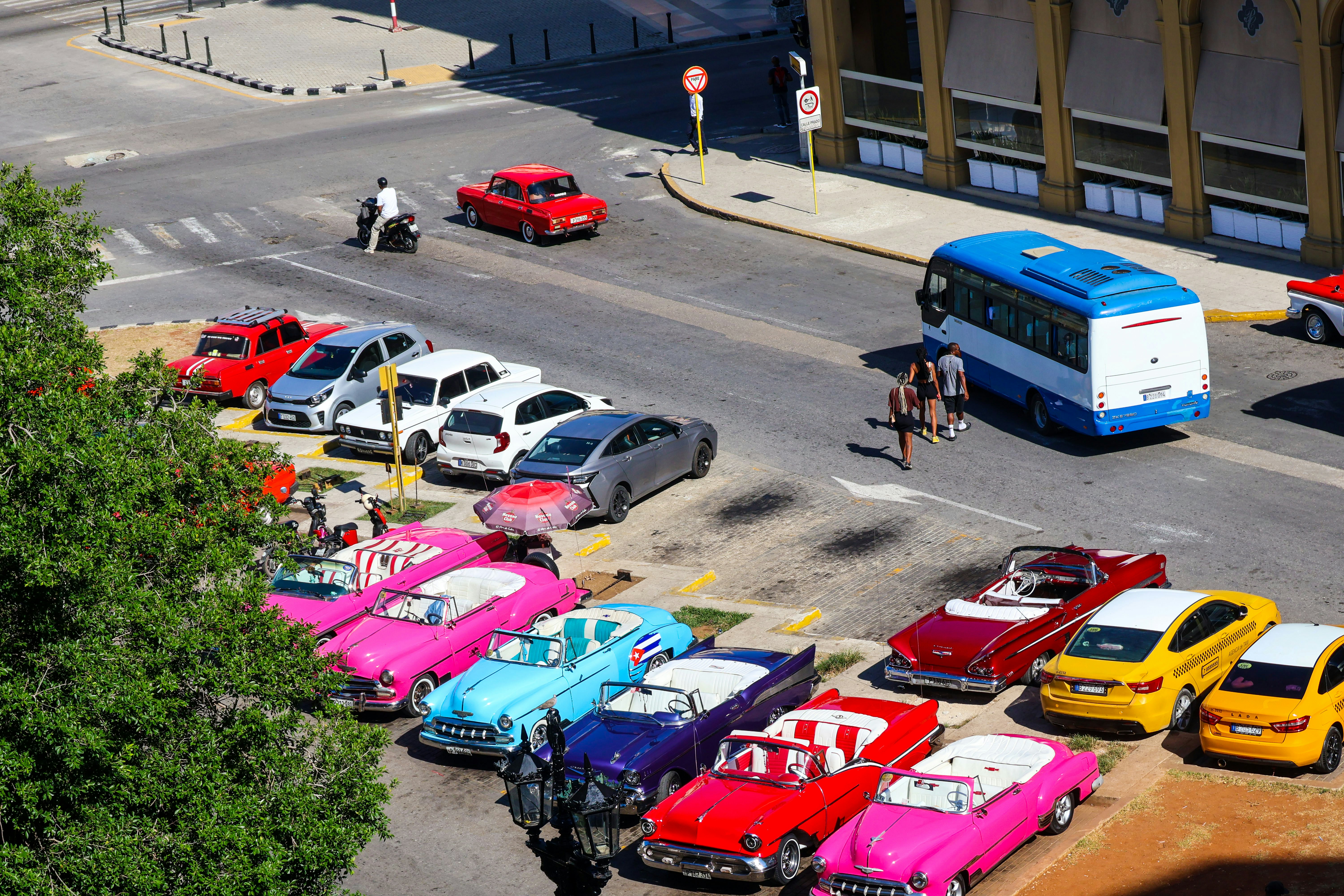 Classic cars parked on a city street.