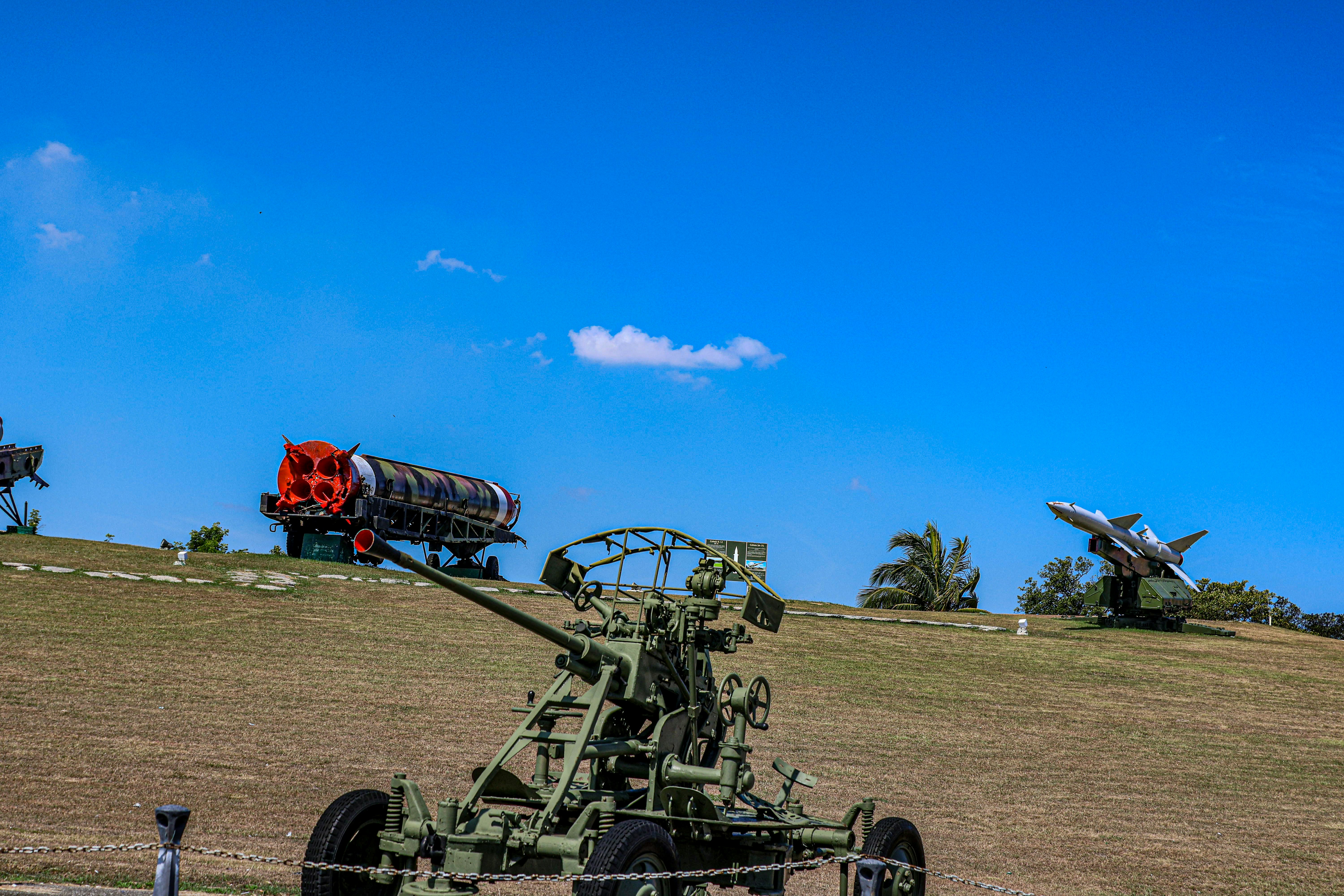 Military equipment is on display with a blue sky.