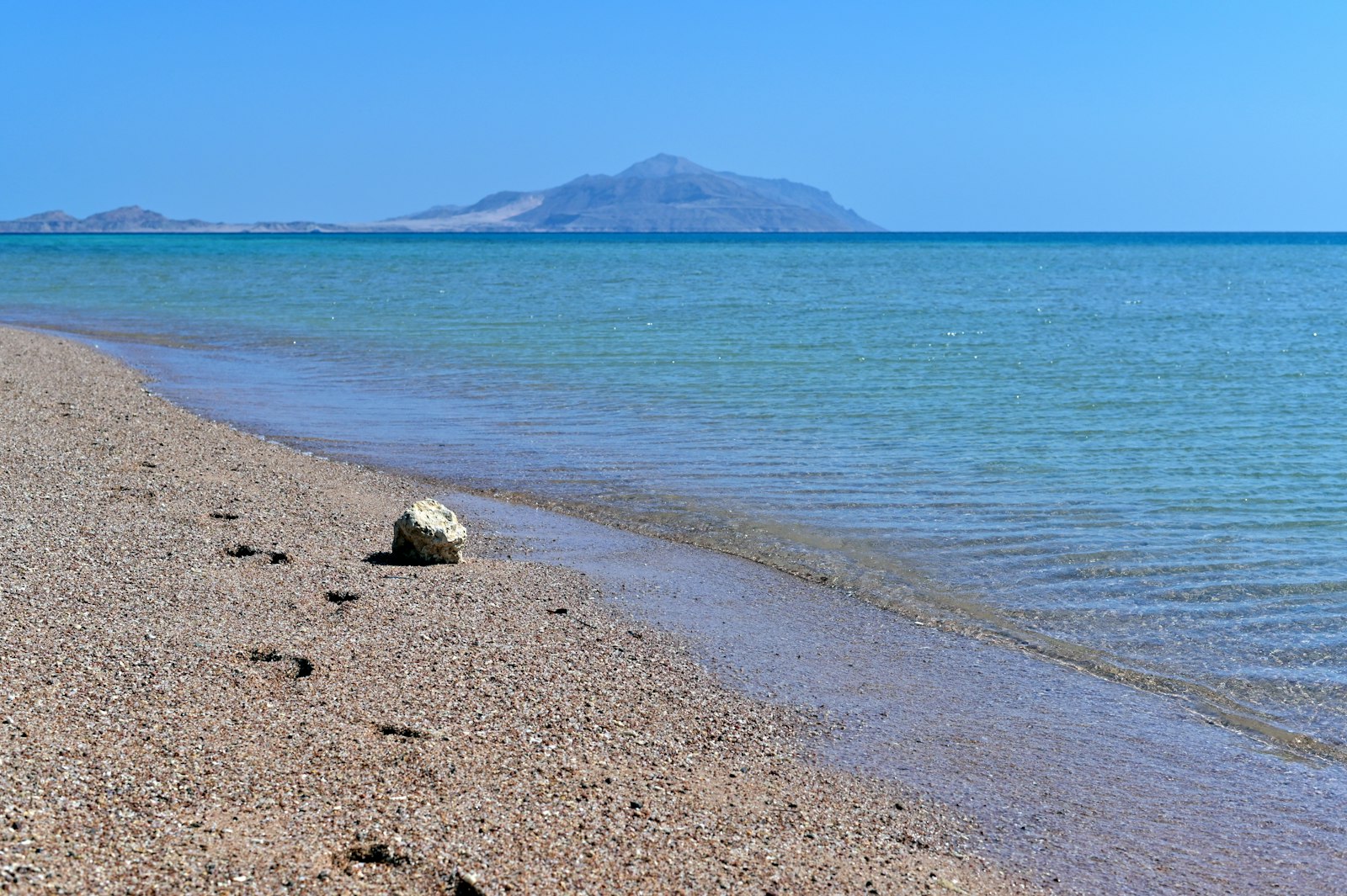 A quiet beach with mountains meeting the Red Sea near Sharm El Sheikh