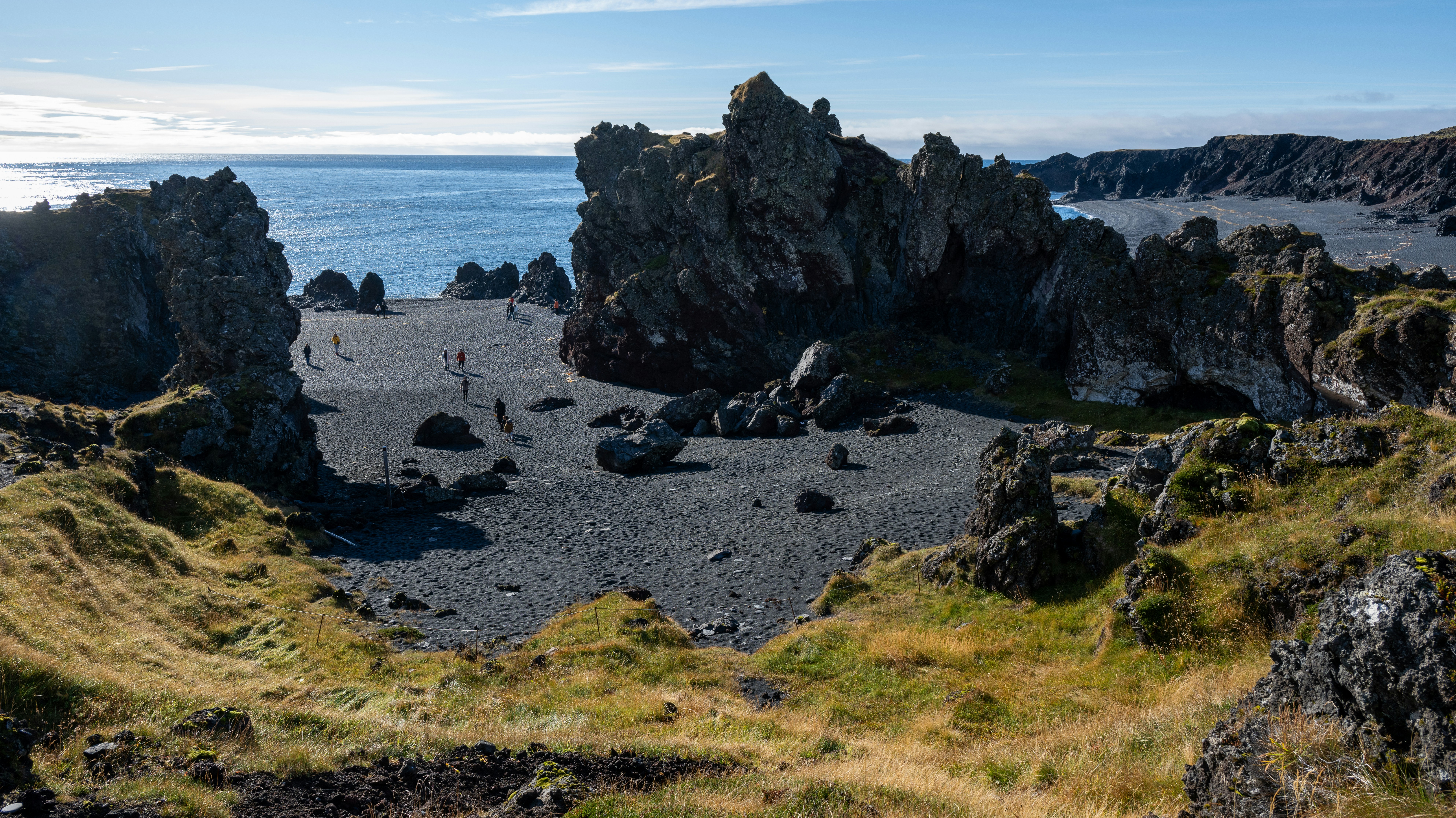 Rocky landscape meets the ocean on a sunny day