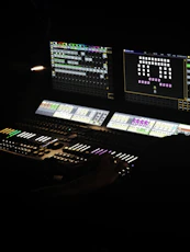 A lighting console controls lights for a performance.