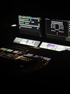 A lighting console controls lights for a performance.