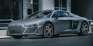 A silver audi r8 sports car.