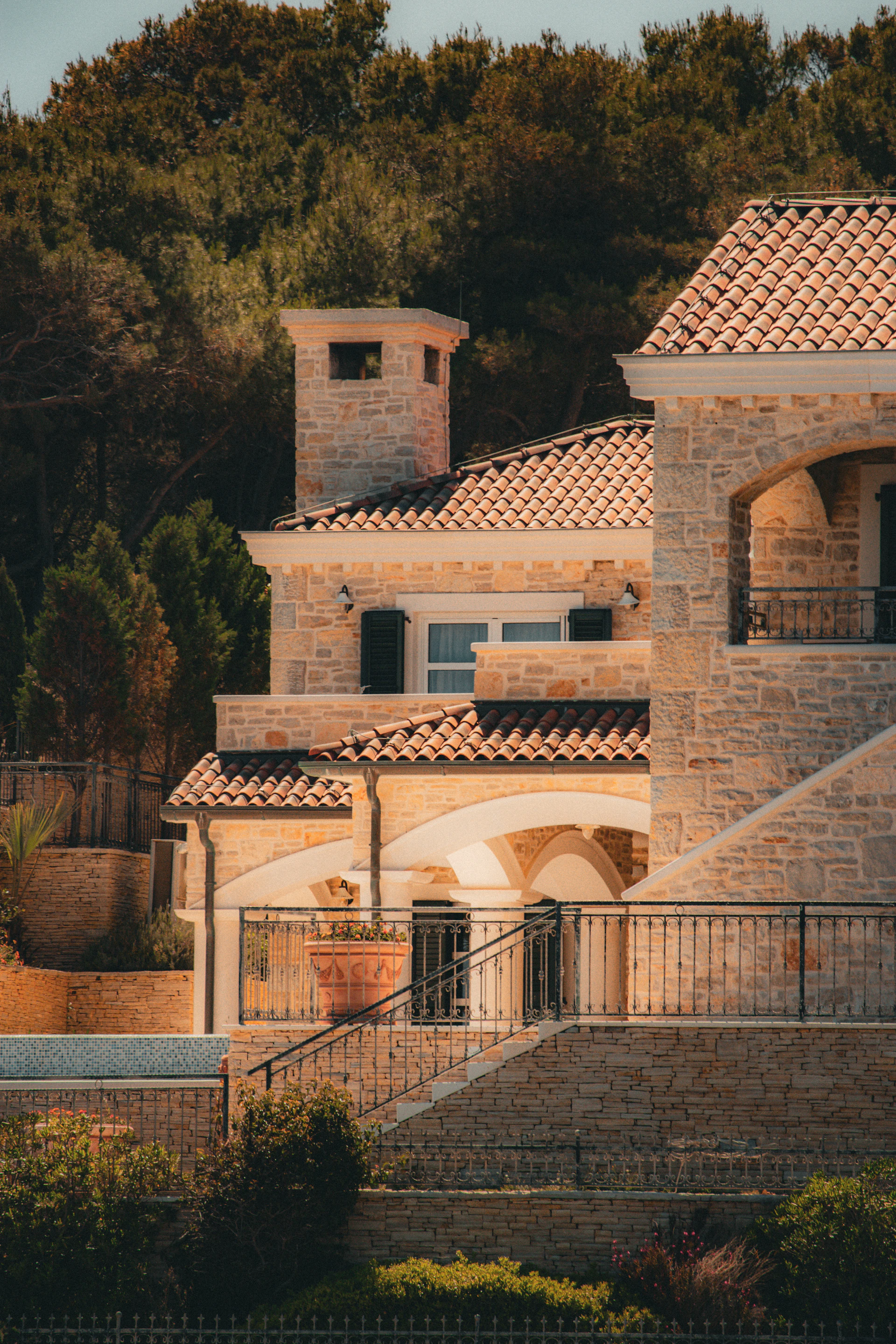 Beautiful stone house with tiled roof.