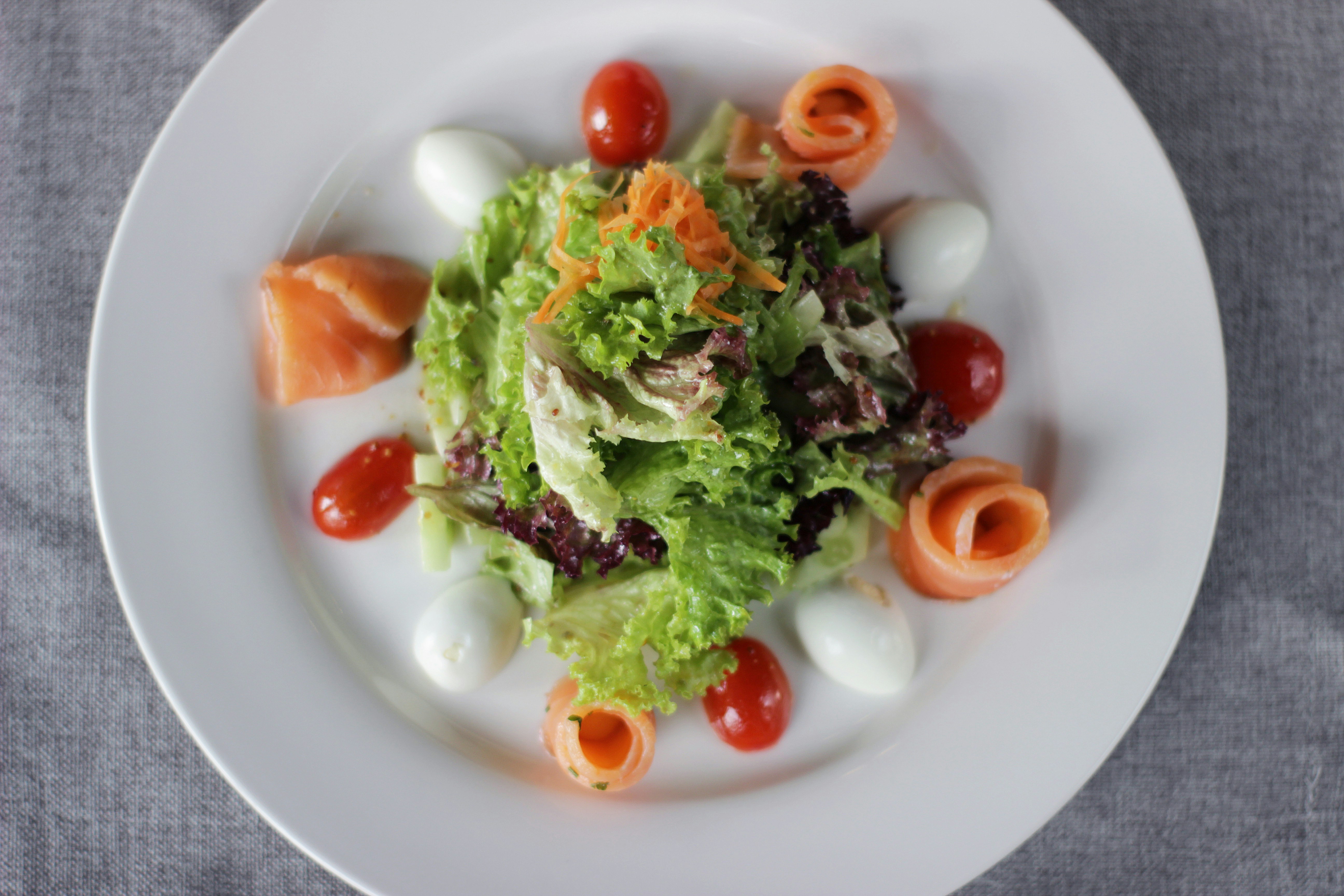 A delicious salad with salmon and other ingredients.