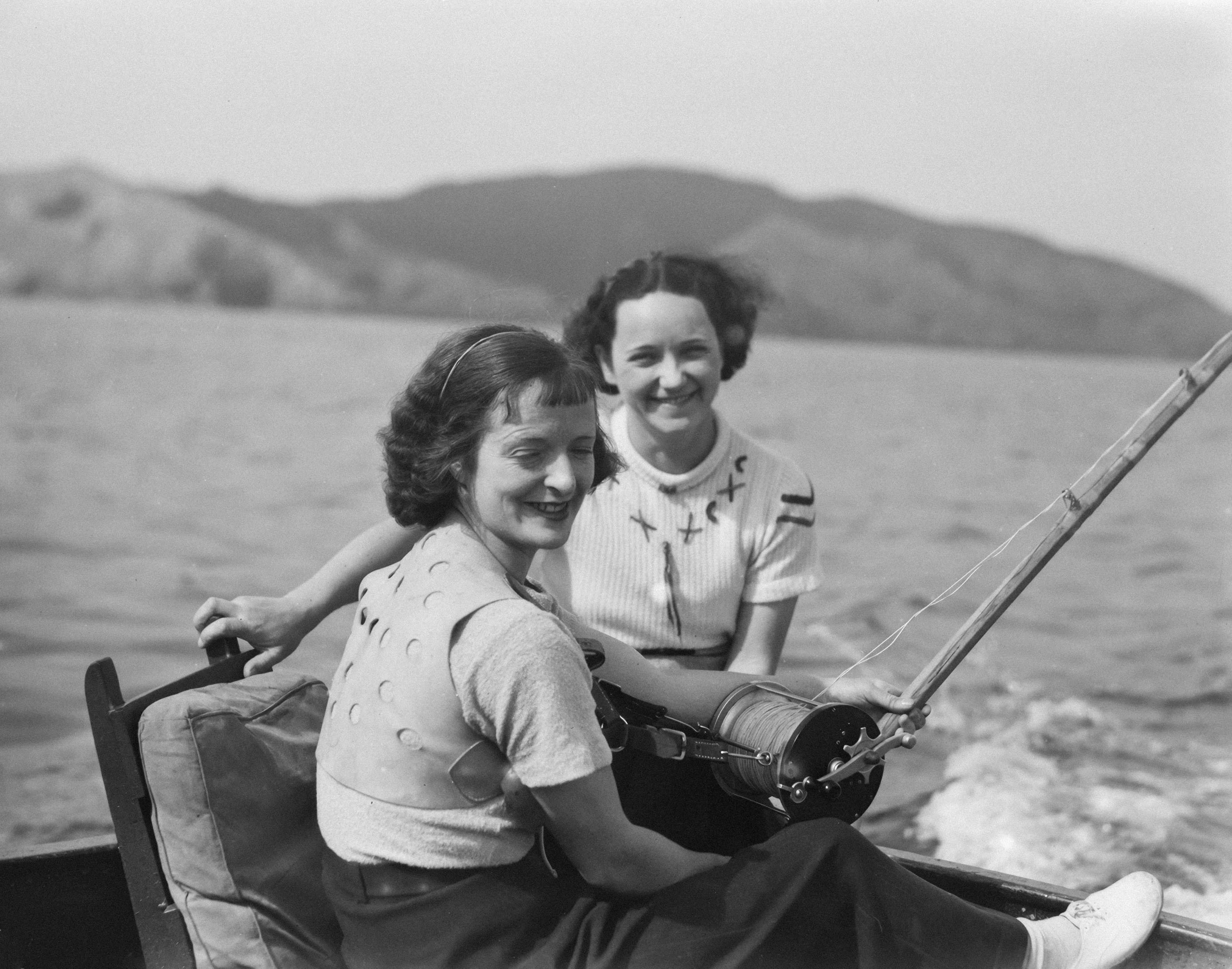 Two women smiling on a boat trip