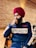 A man in a turban looks thoughtful.
