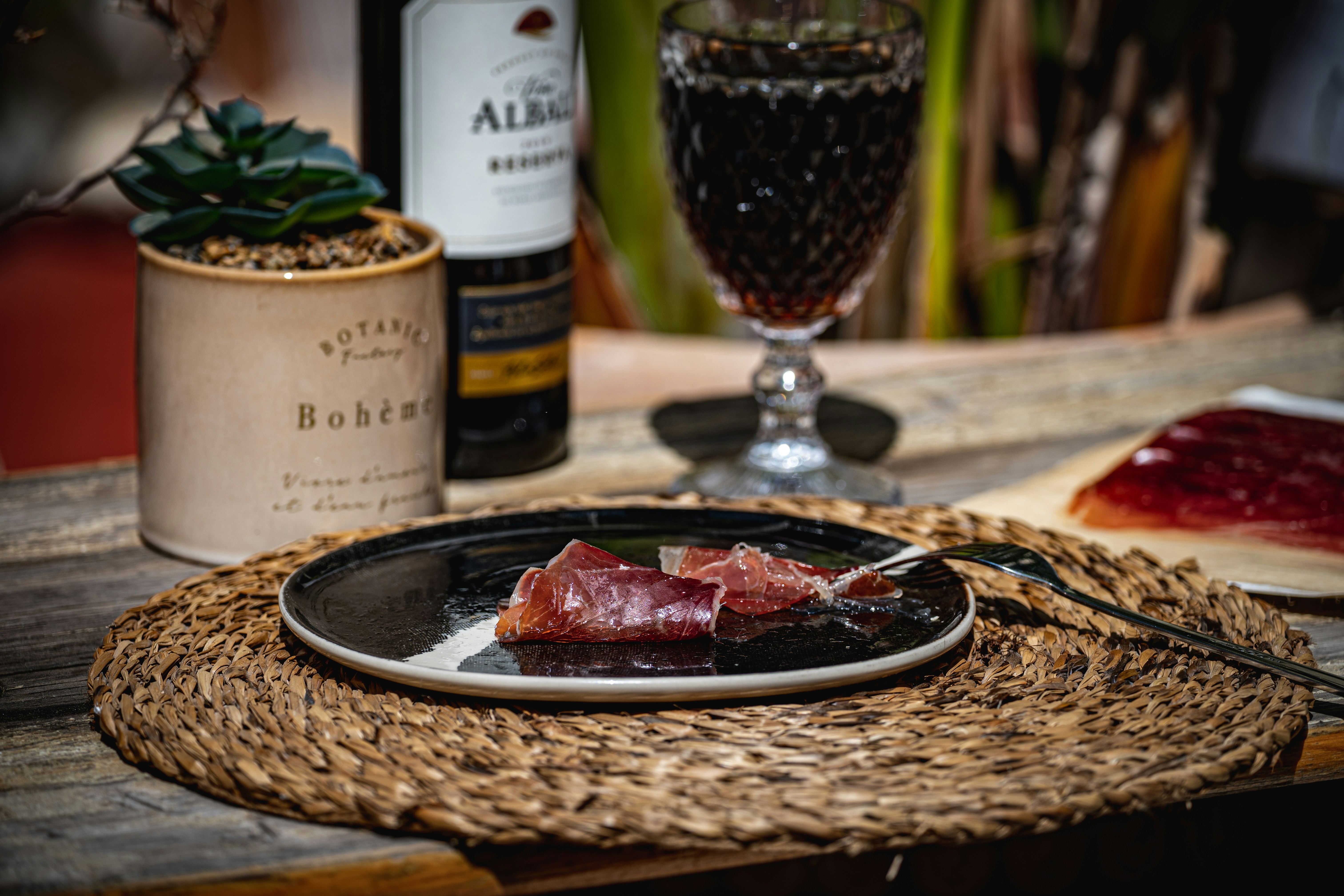 Wine, meat, and a cozy, appetizing spread
