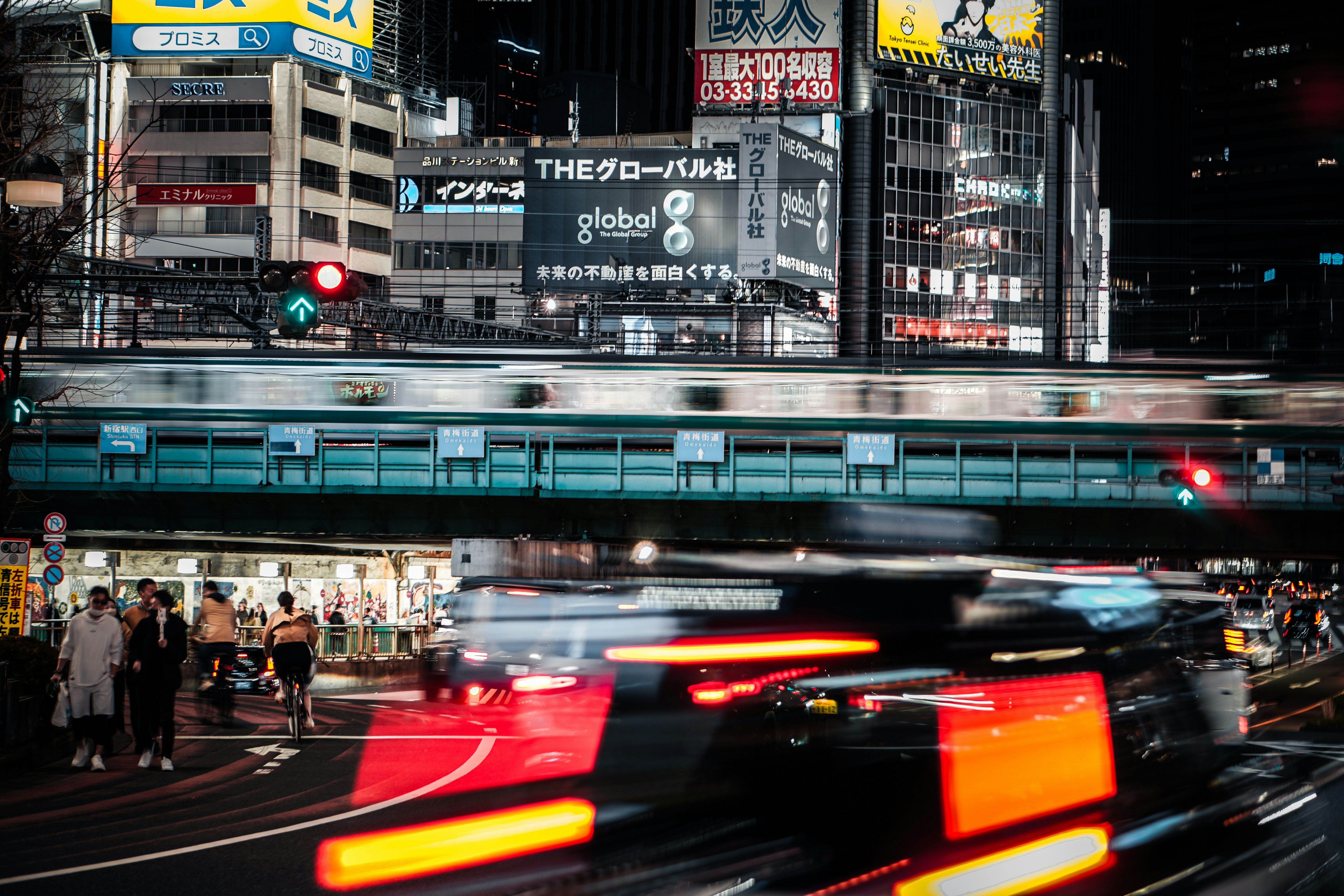 Nighttime tokyo city scene with a blurred train.