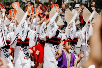 People are performing a traditional japanese dance.