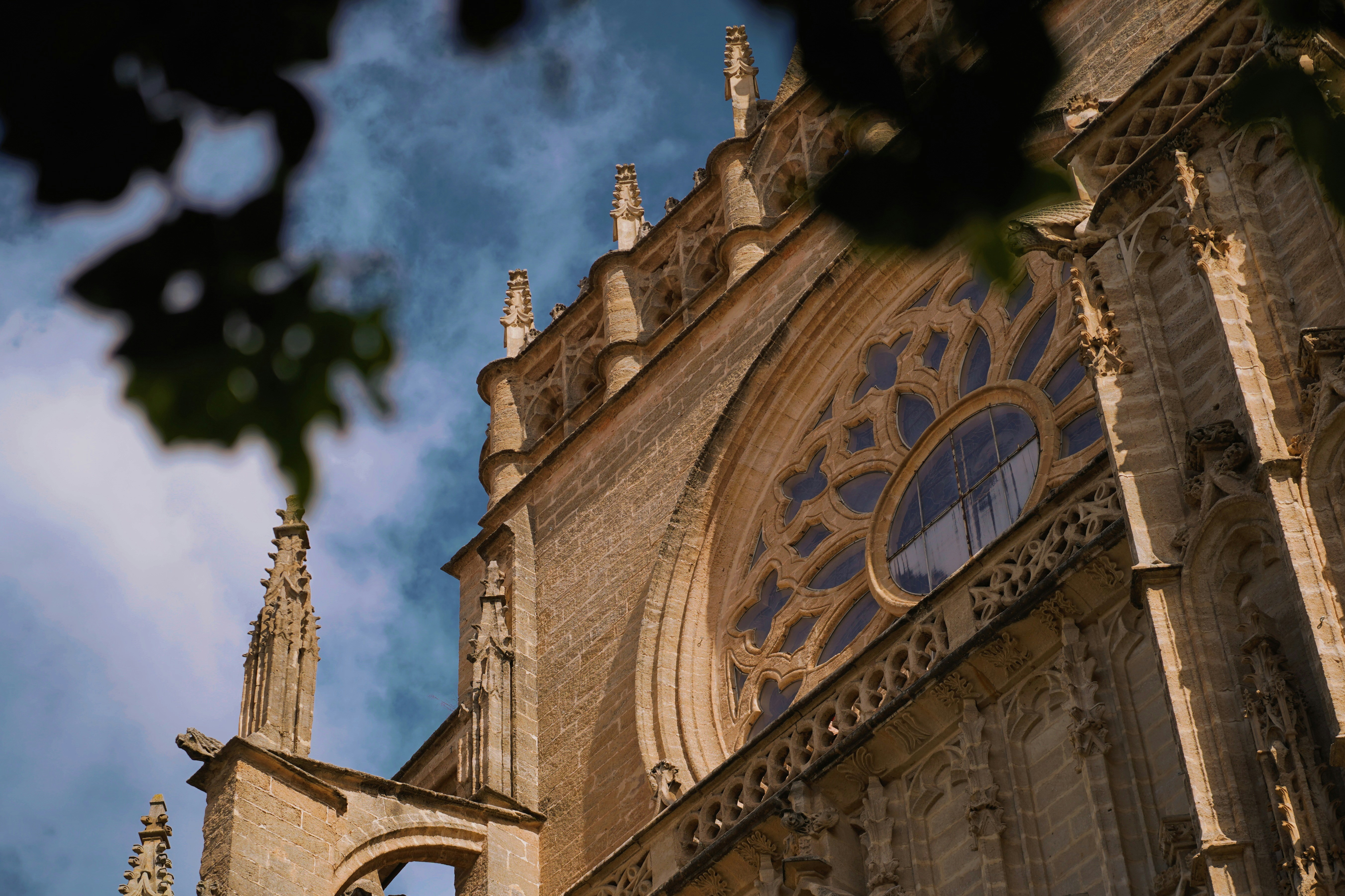 The gothic cathedral reaches into the blue sky.