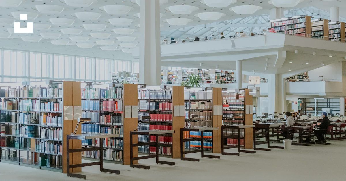 A modern library with bookshelves and a unique ceiling. photo – Free ...