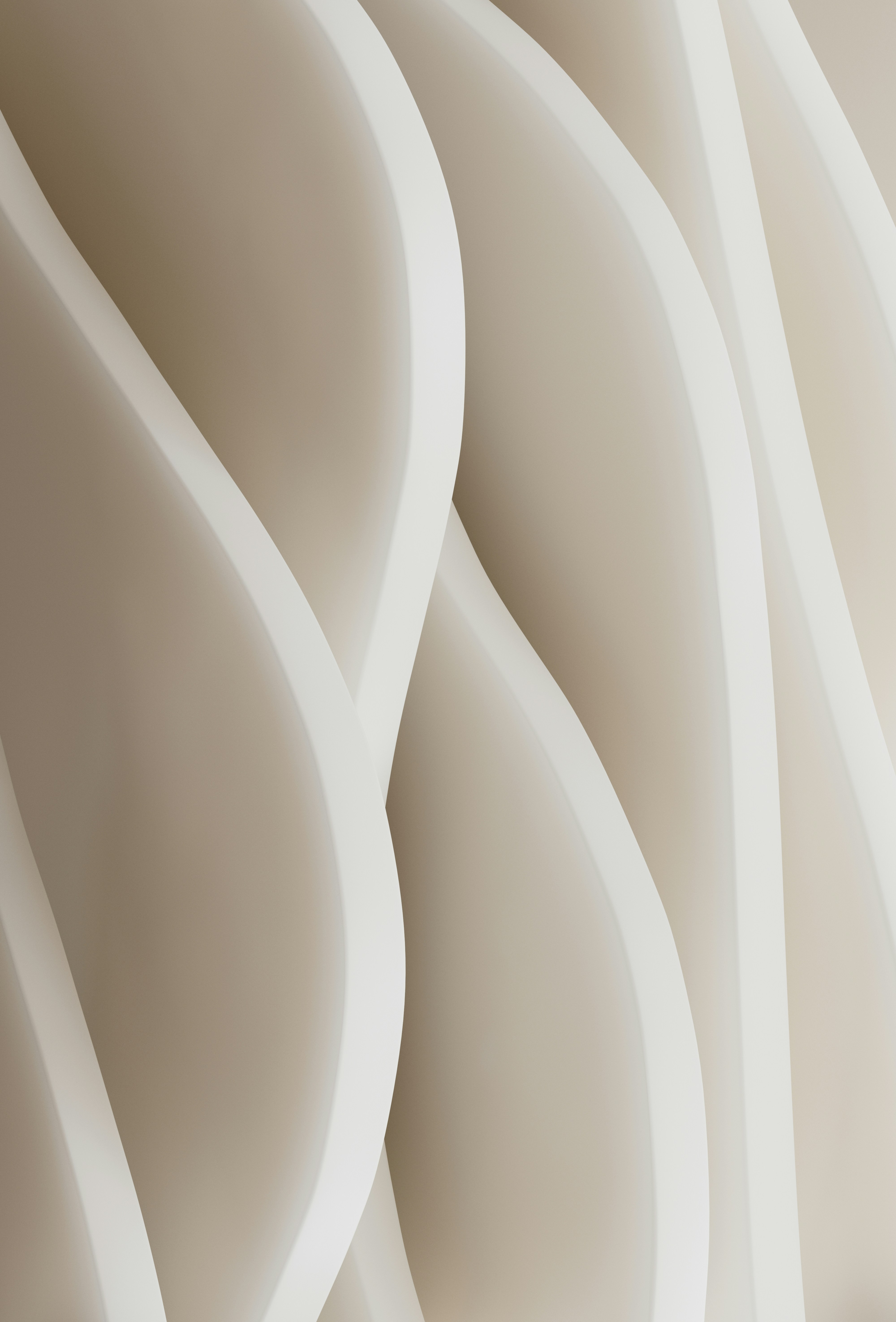 Arquitectura curva y abstracta en tonos beige.