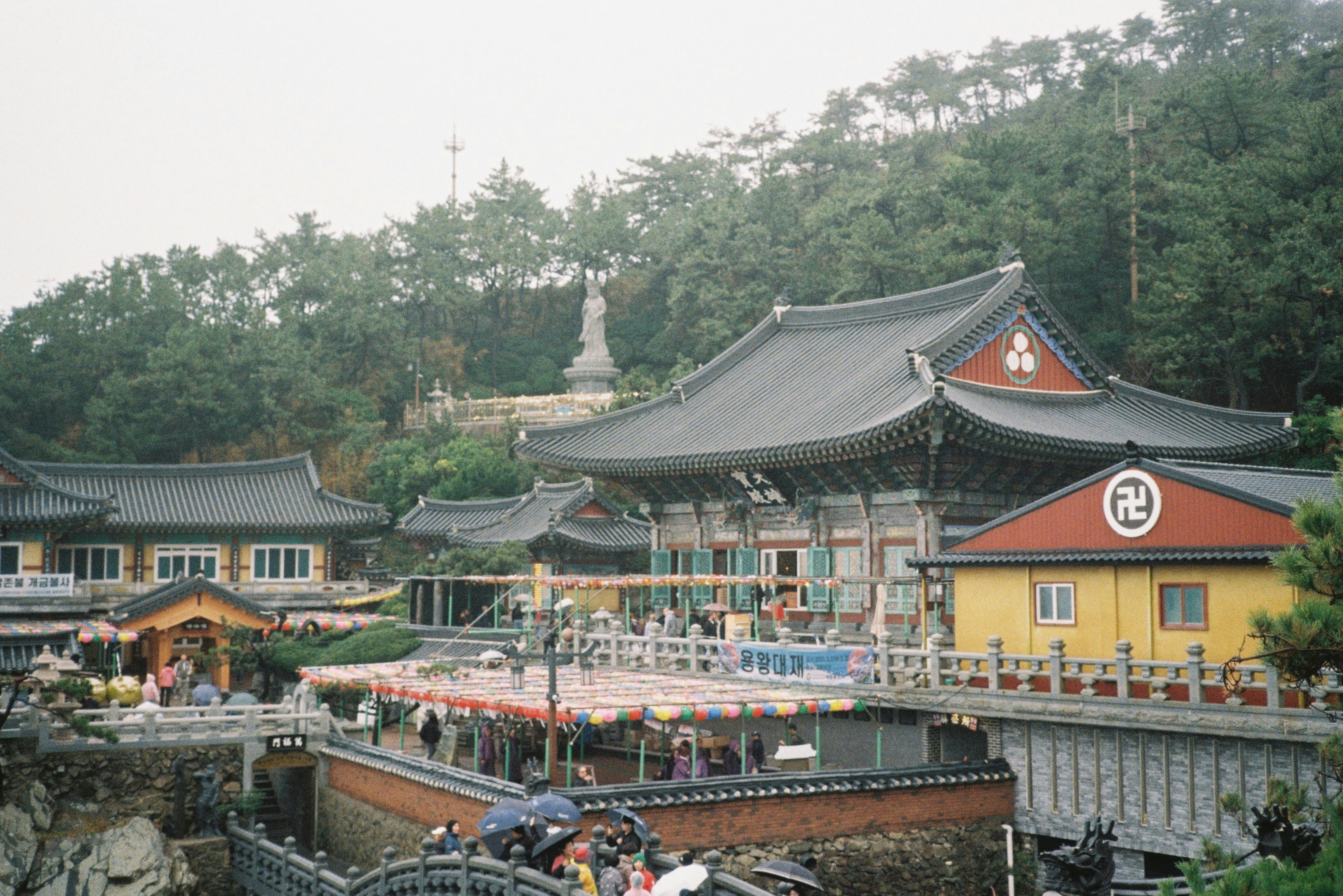 Buddhist temple complex nestled in a lush, green landscape.