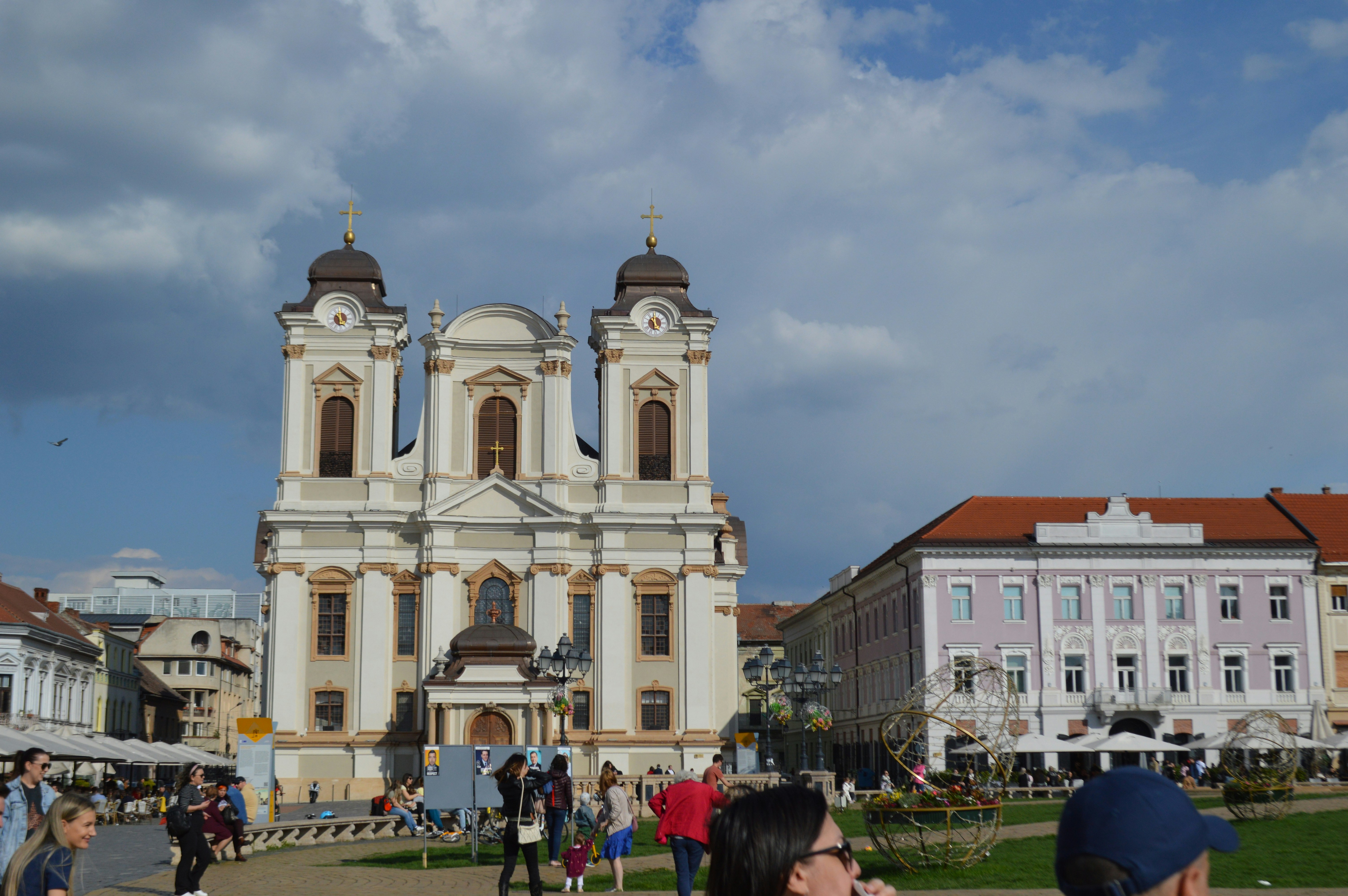 A grand church stands proudly under a cloudy sky.