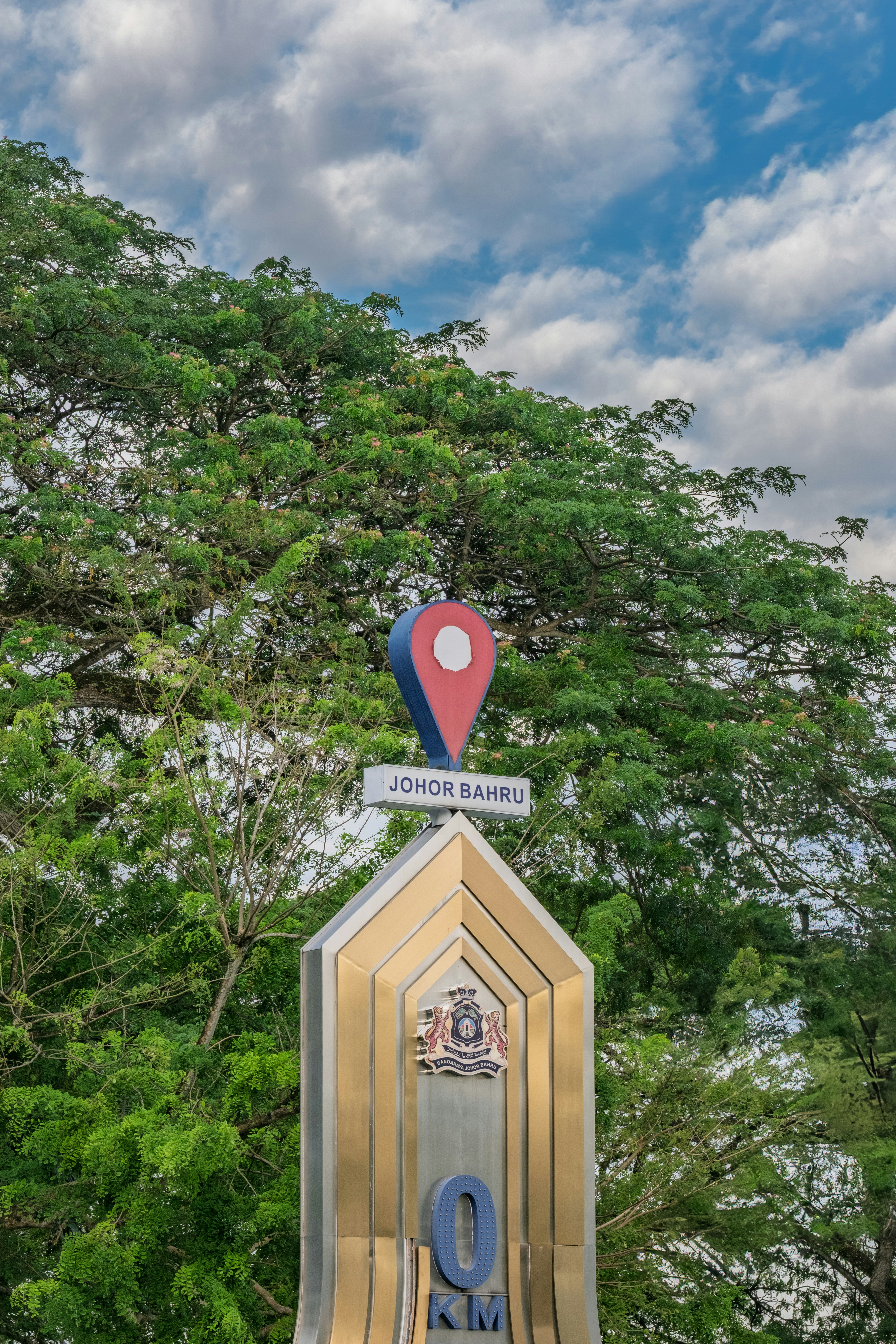 A sign marks the way to johor bahru, malaysia.