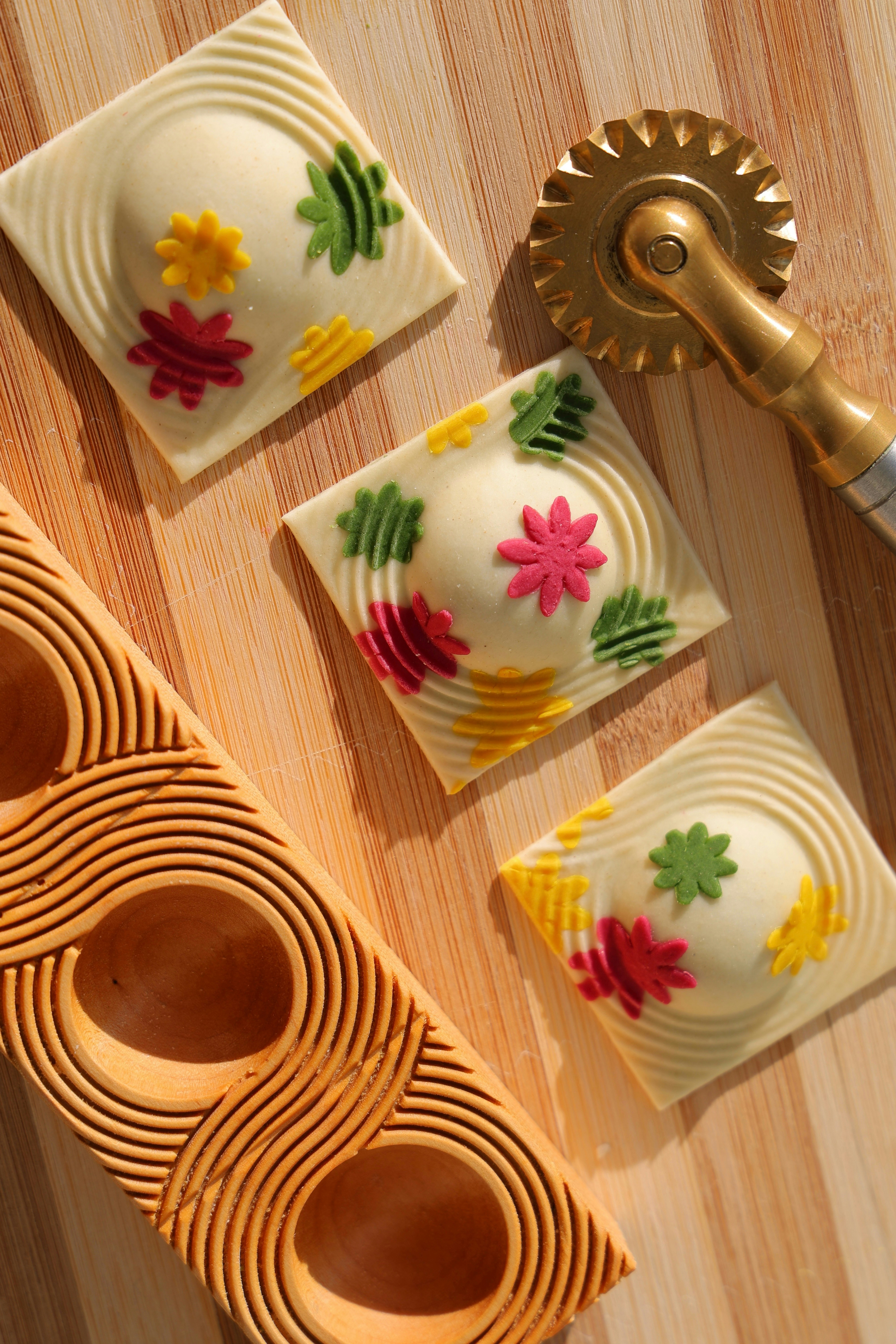 Delicious ravioli decorated with vibrant floral designs. photo – Free ...