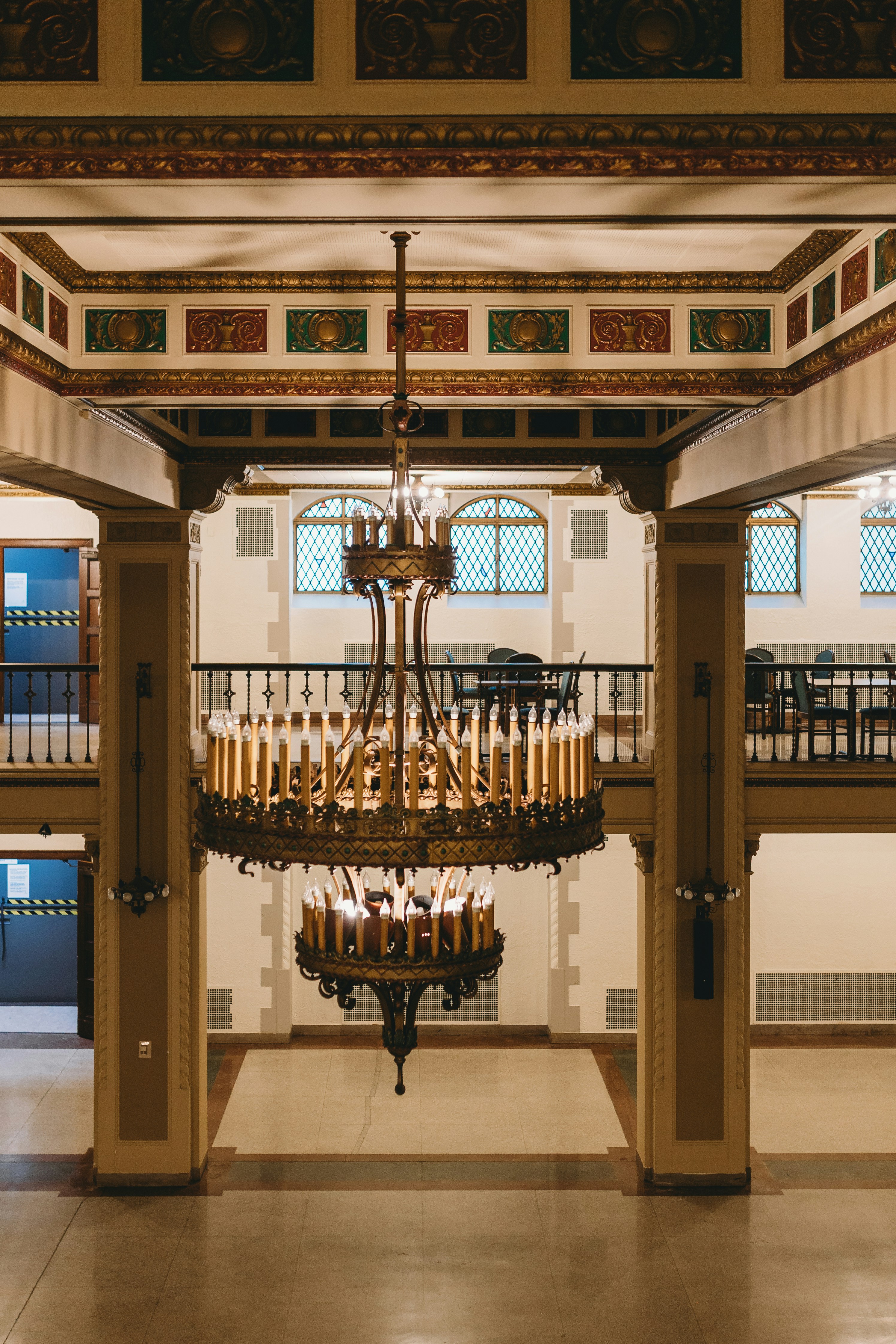 A grand chandelier hangs in a beautiful interior.