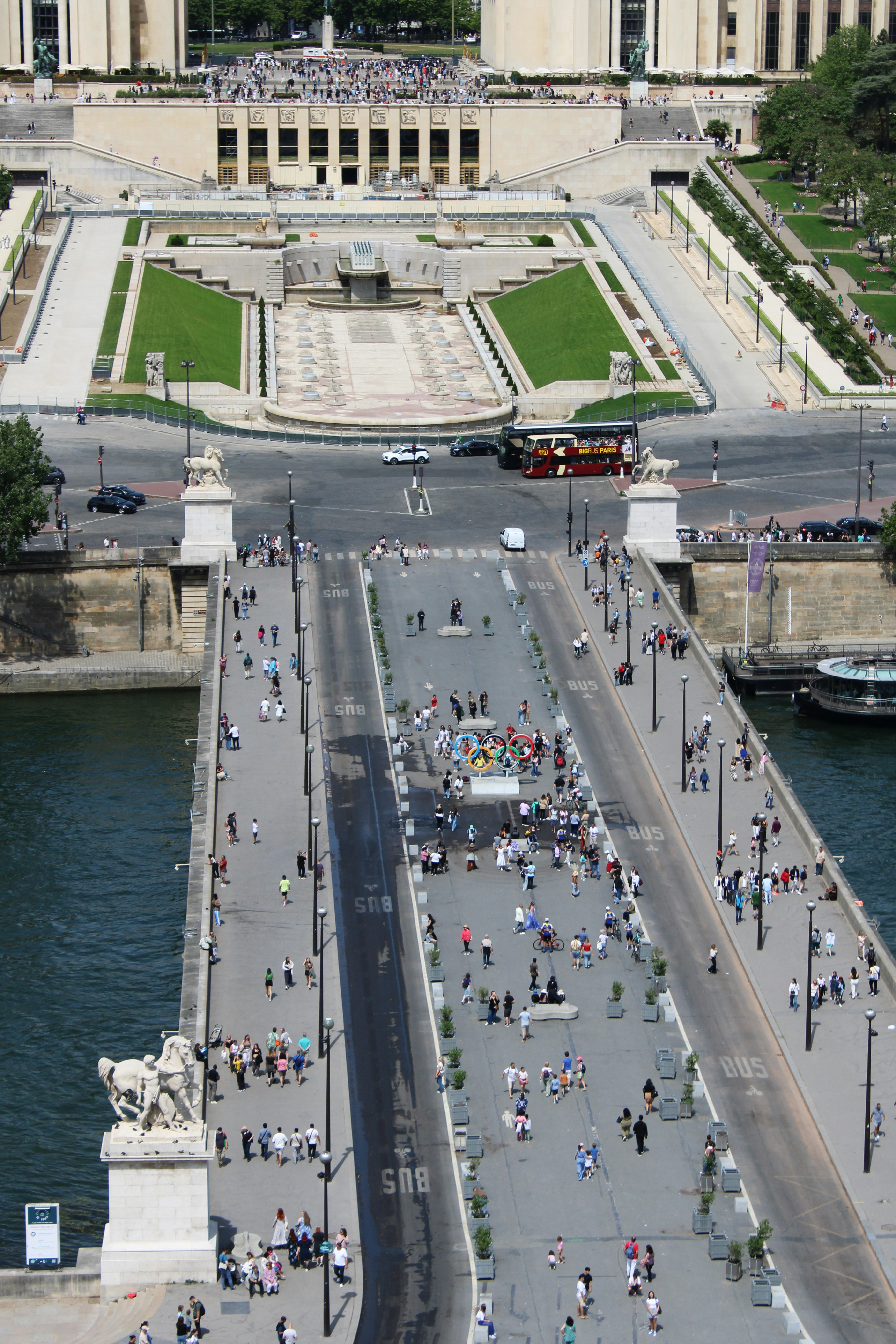 People walk along a bridge in paris