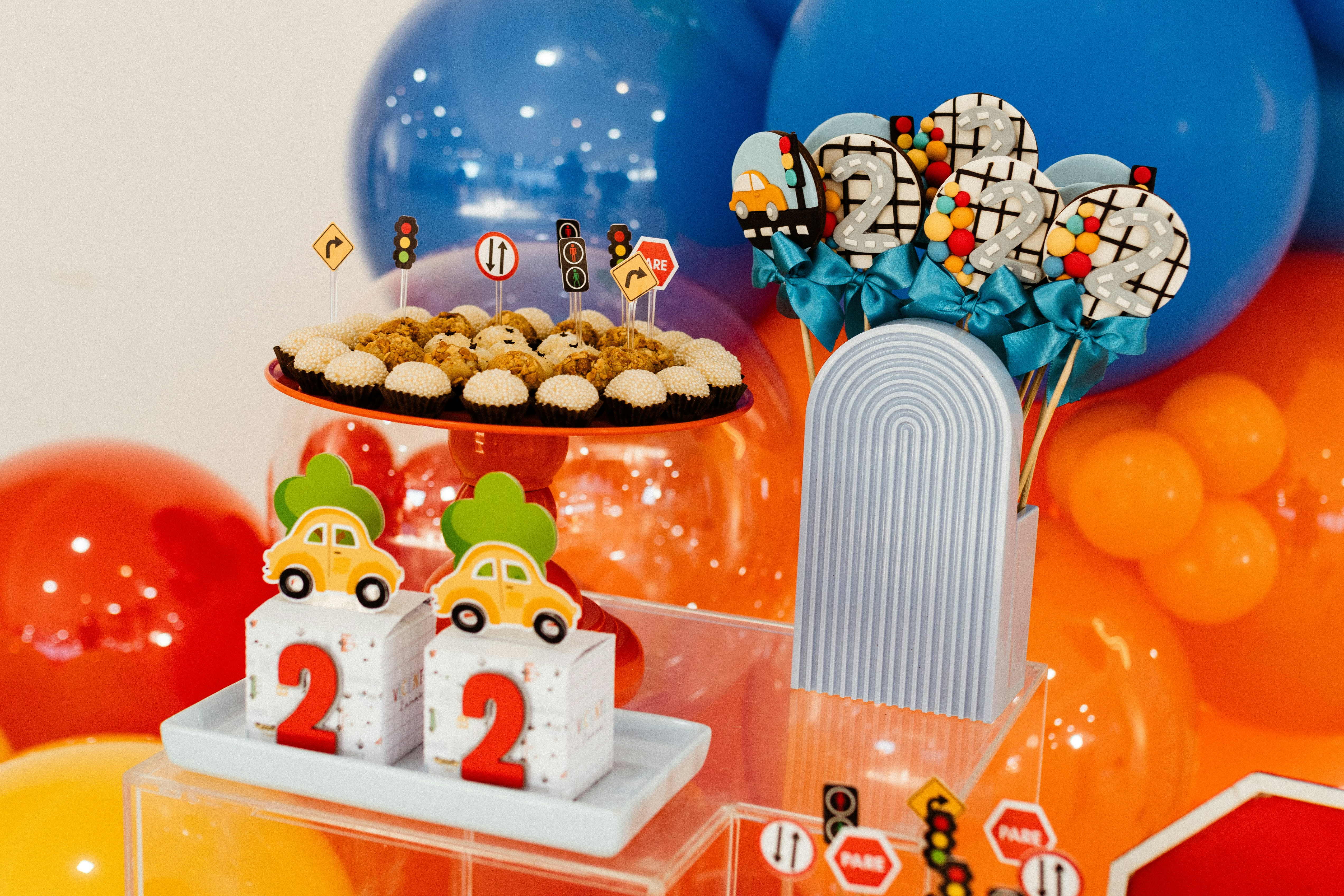 It is a vibrant car-themed birthday party display.