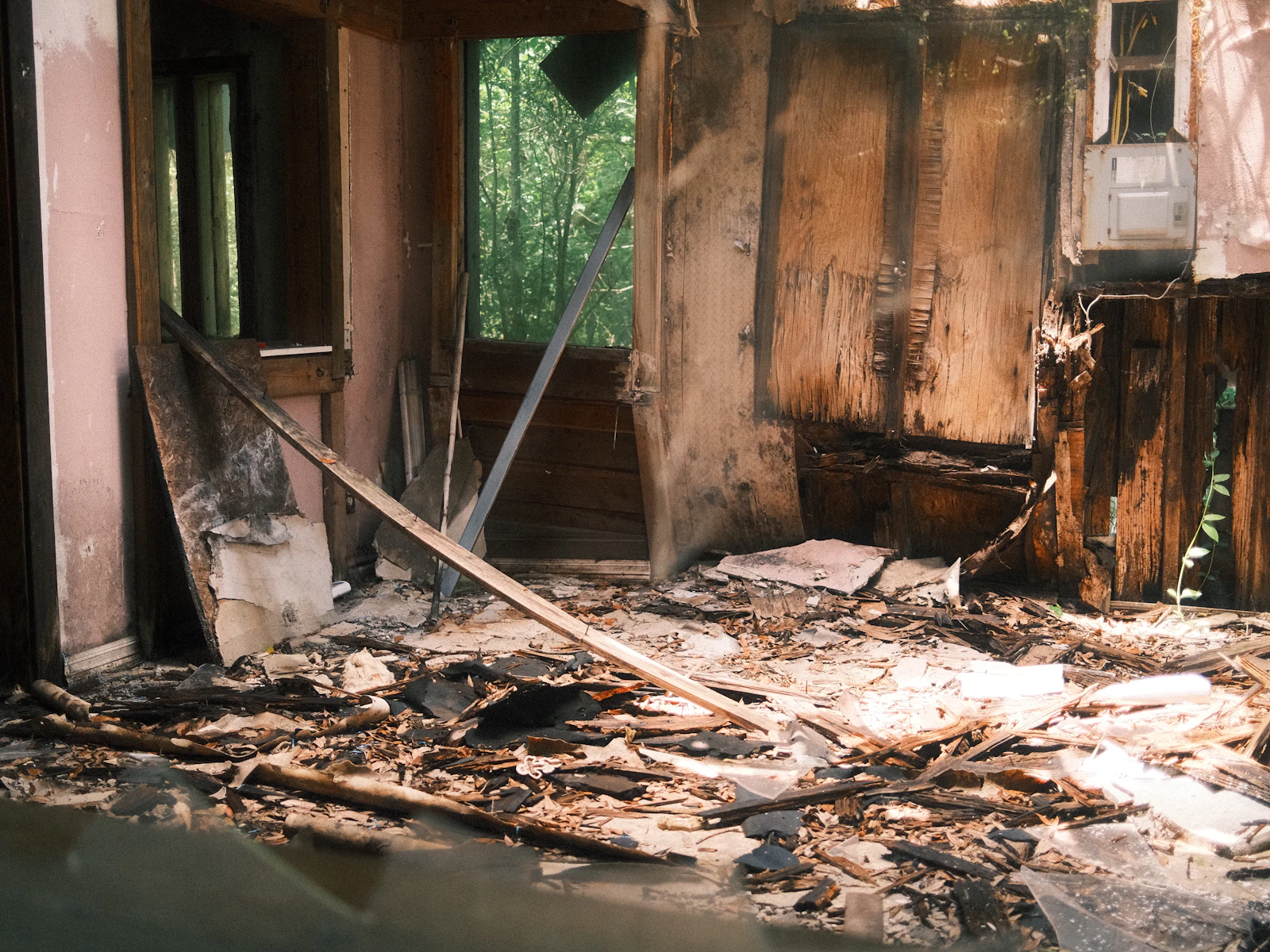 Interior of a Kitsap County home showing smoke and soot damage on walls and ceiling after a fire