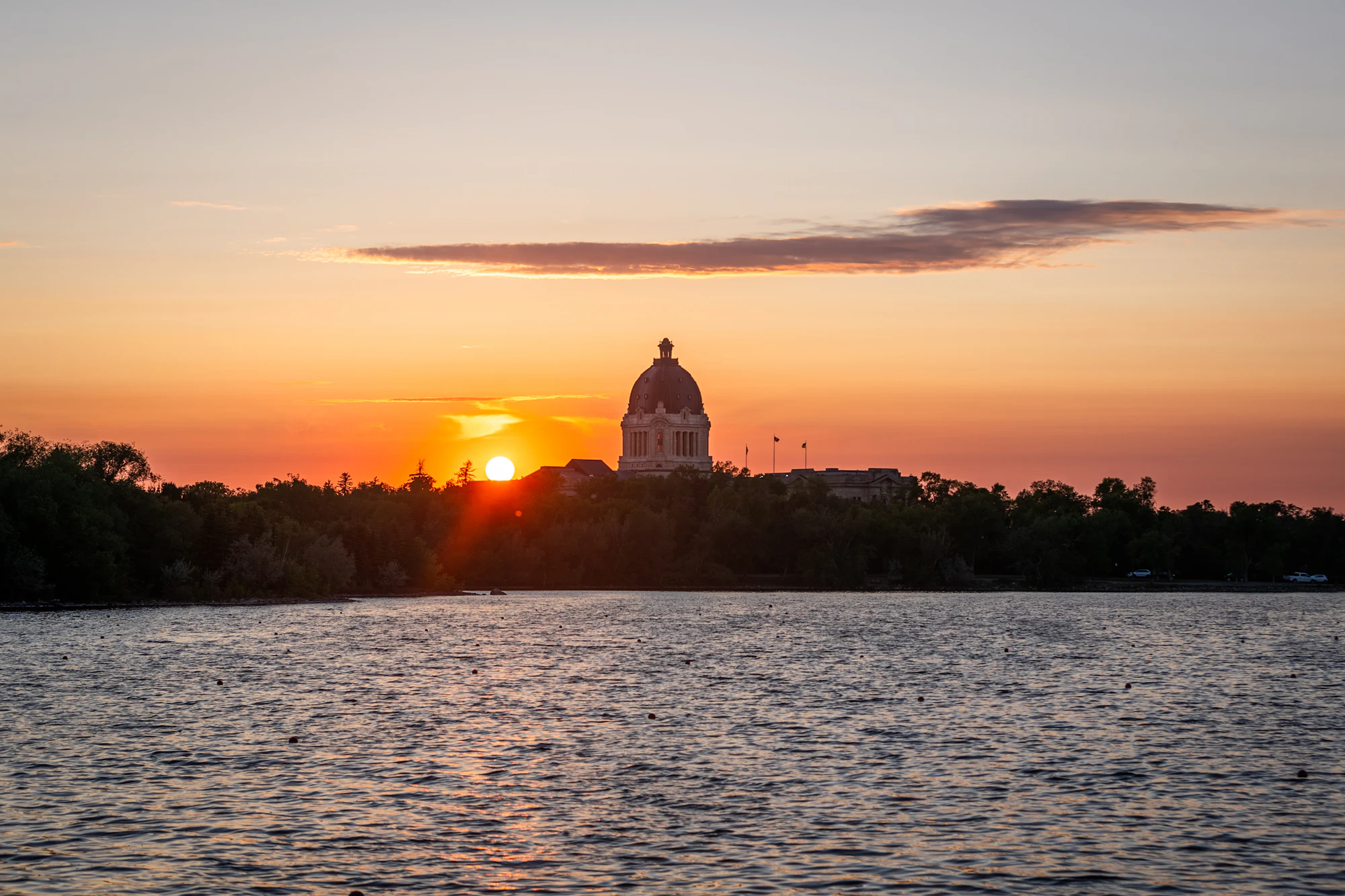 Regina skyline at sunset over Wascana Lake