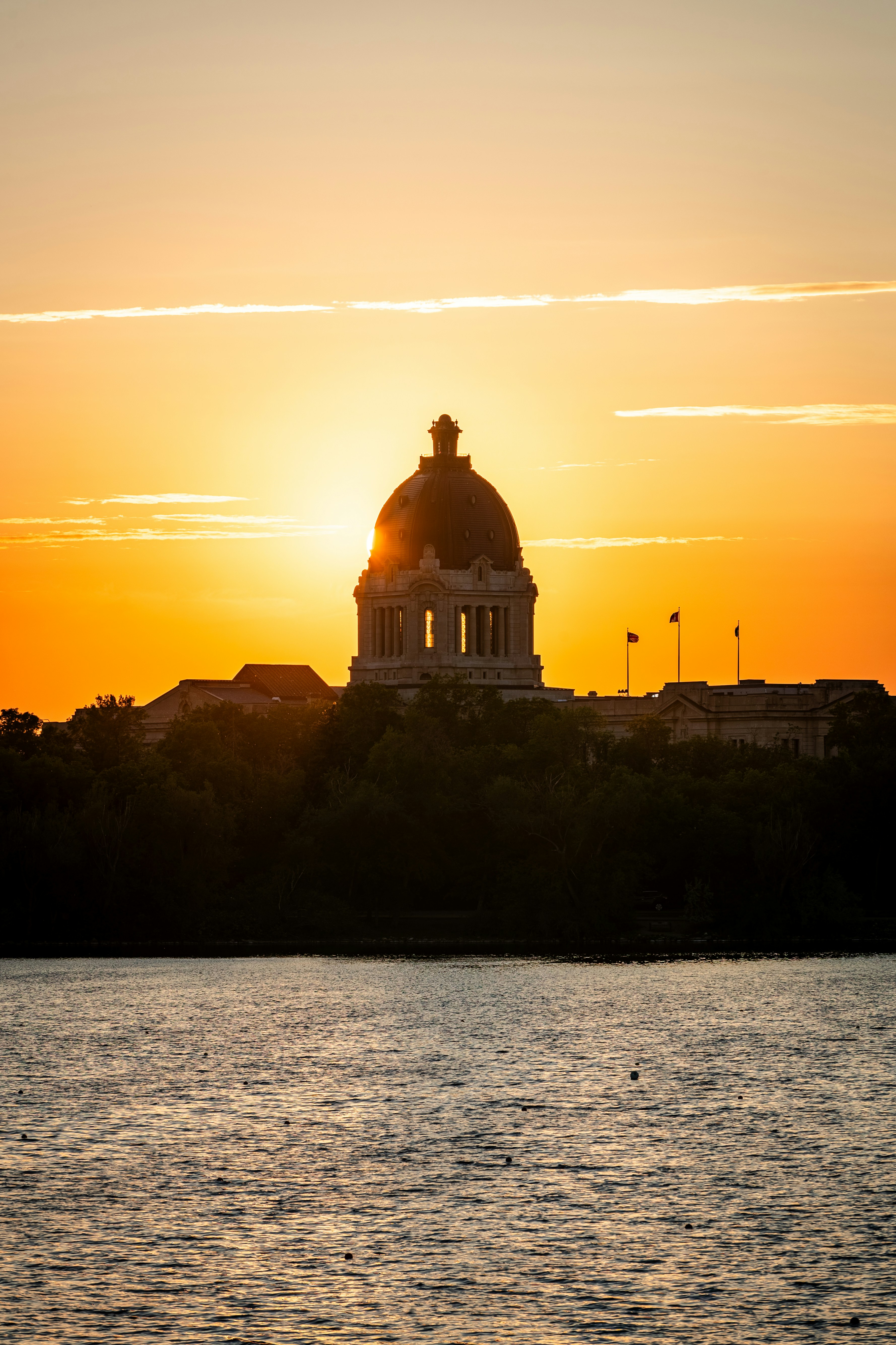Sunset illuminates the manitoba legislative building.