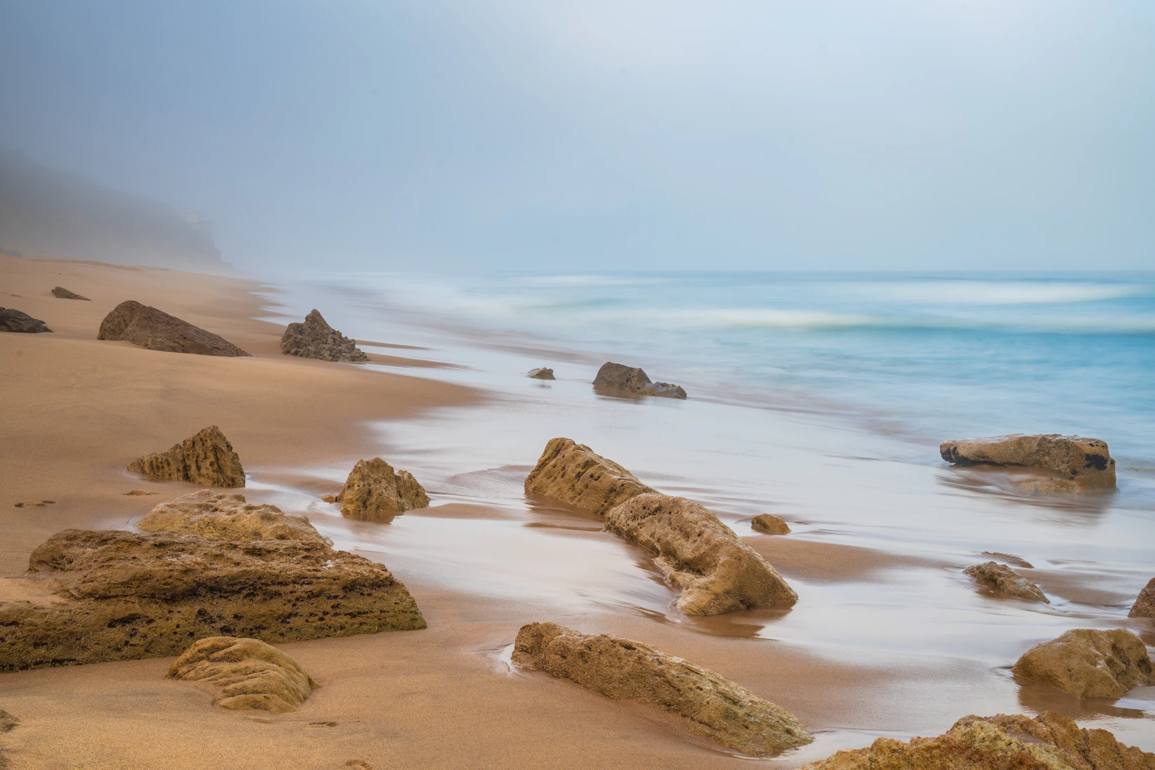 Quiet beach cove with gentle waves