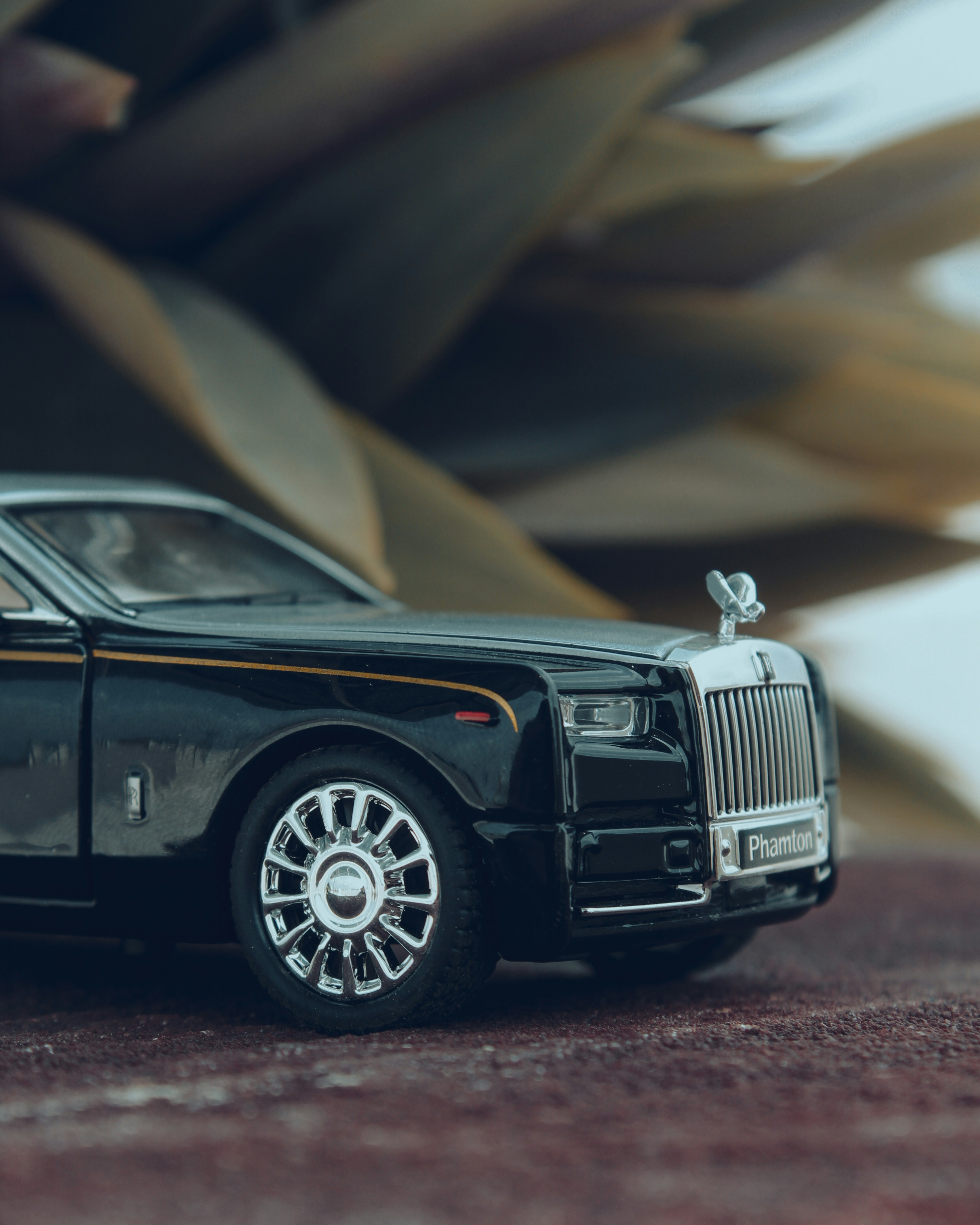 A black rolls royce model is beautiful.