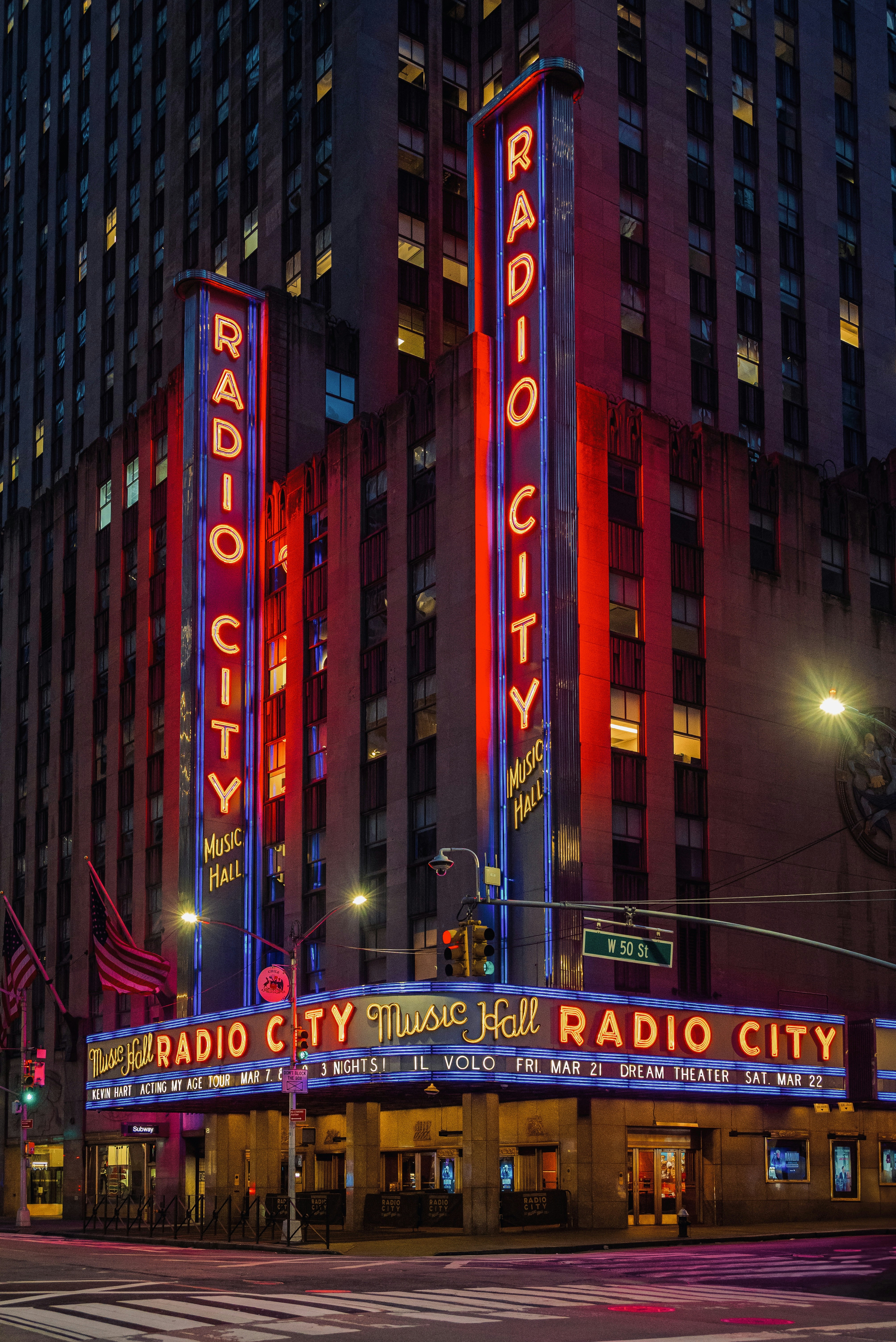 Radio city music hall stands tall at night.