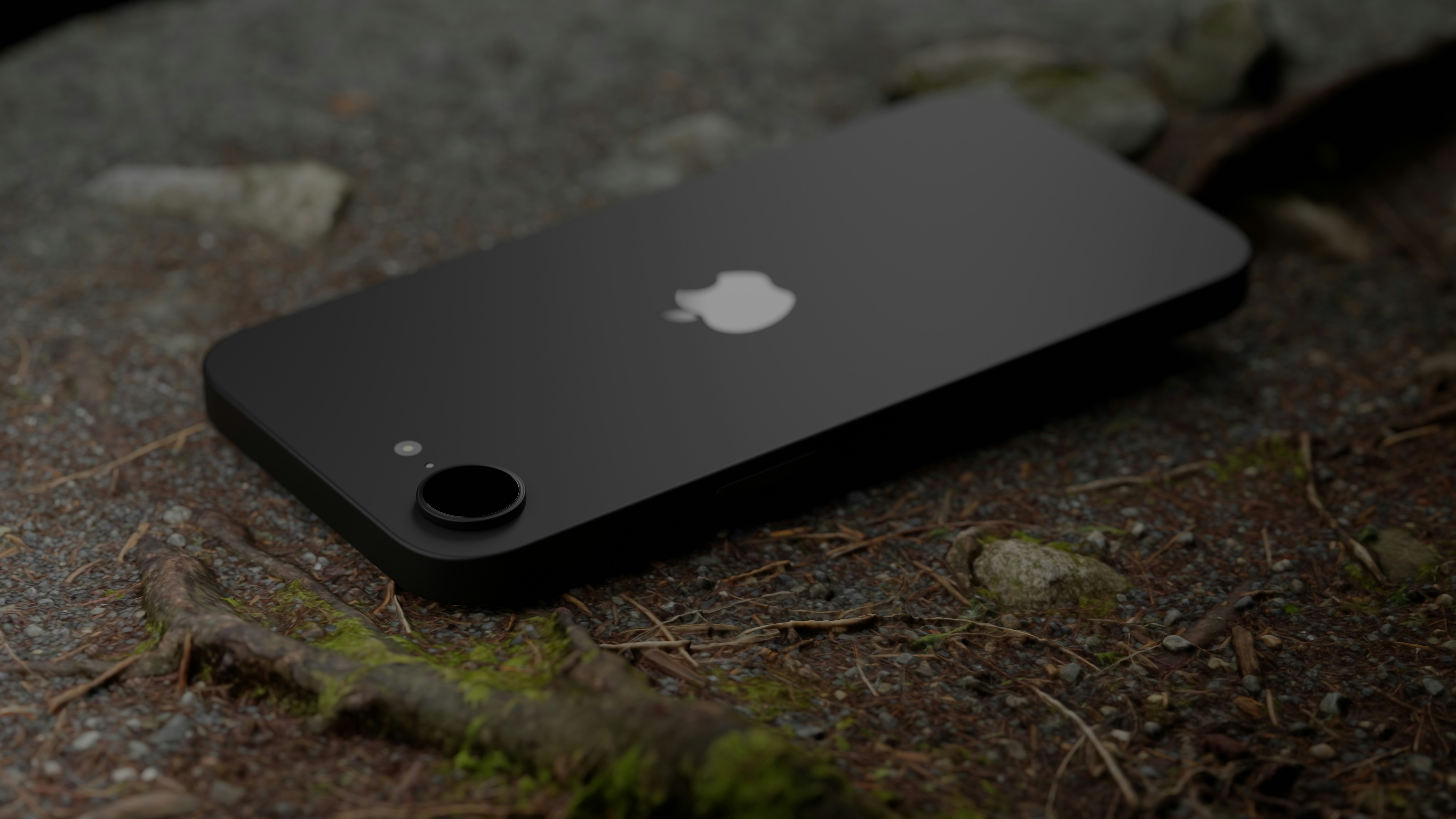 A black iPhone sits on a forest floor.