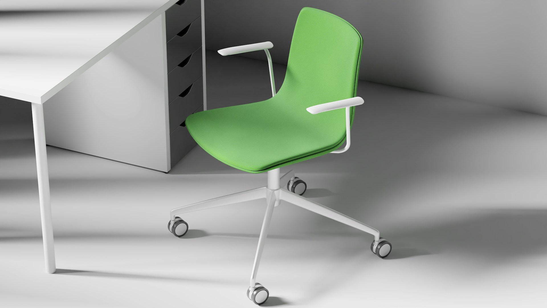 A green office chair next to a white desk.