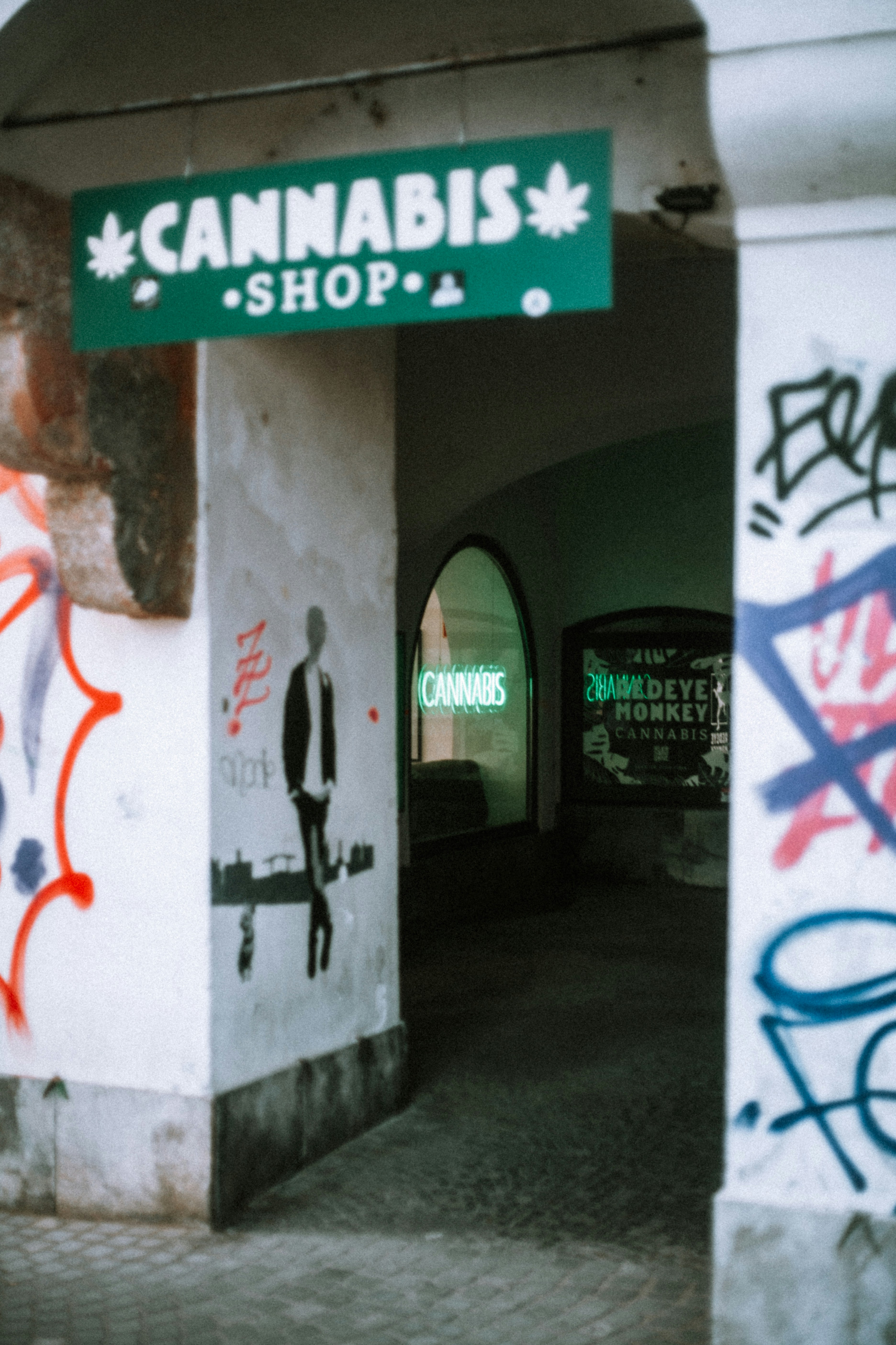 A cannabis shop sign marks the store's entrance.