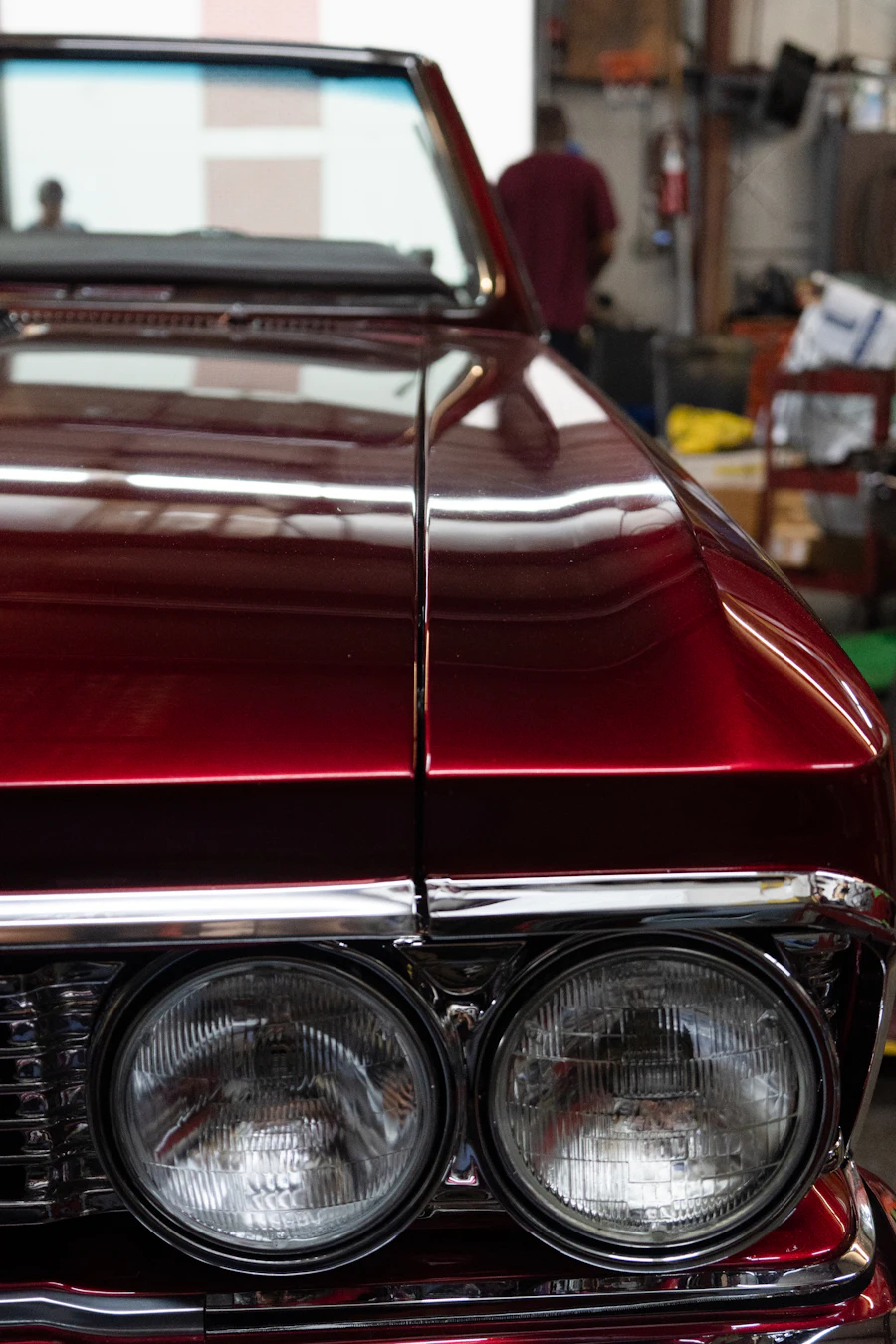 Close view of a polished red vehicle headlight