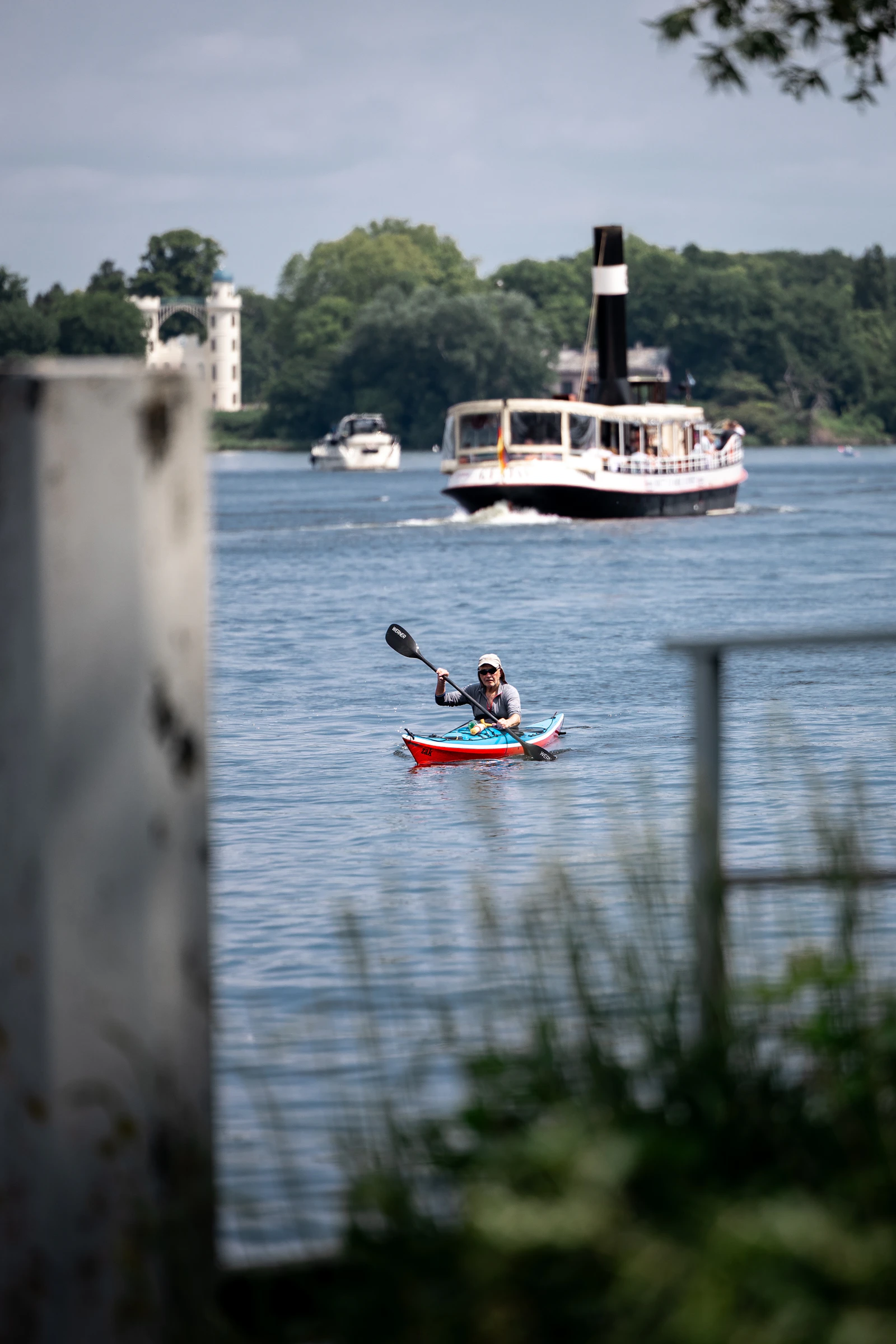 A kayaker paddling on a river
