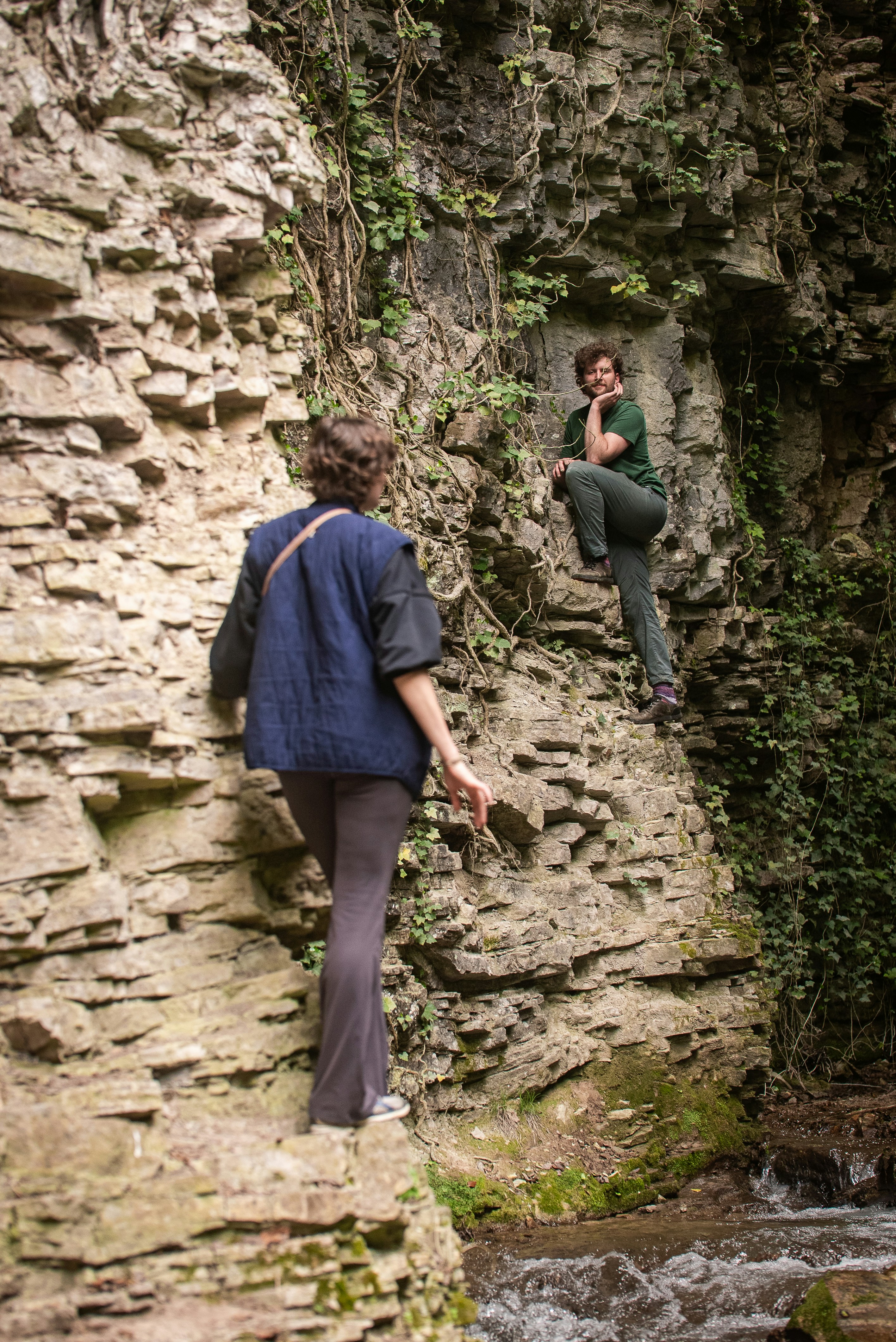 People are climbing on a rocky cliff face.