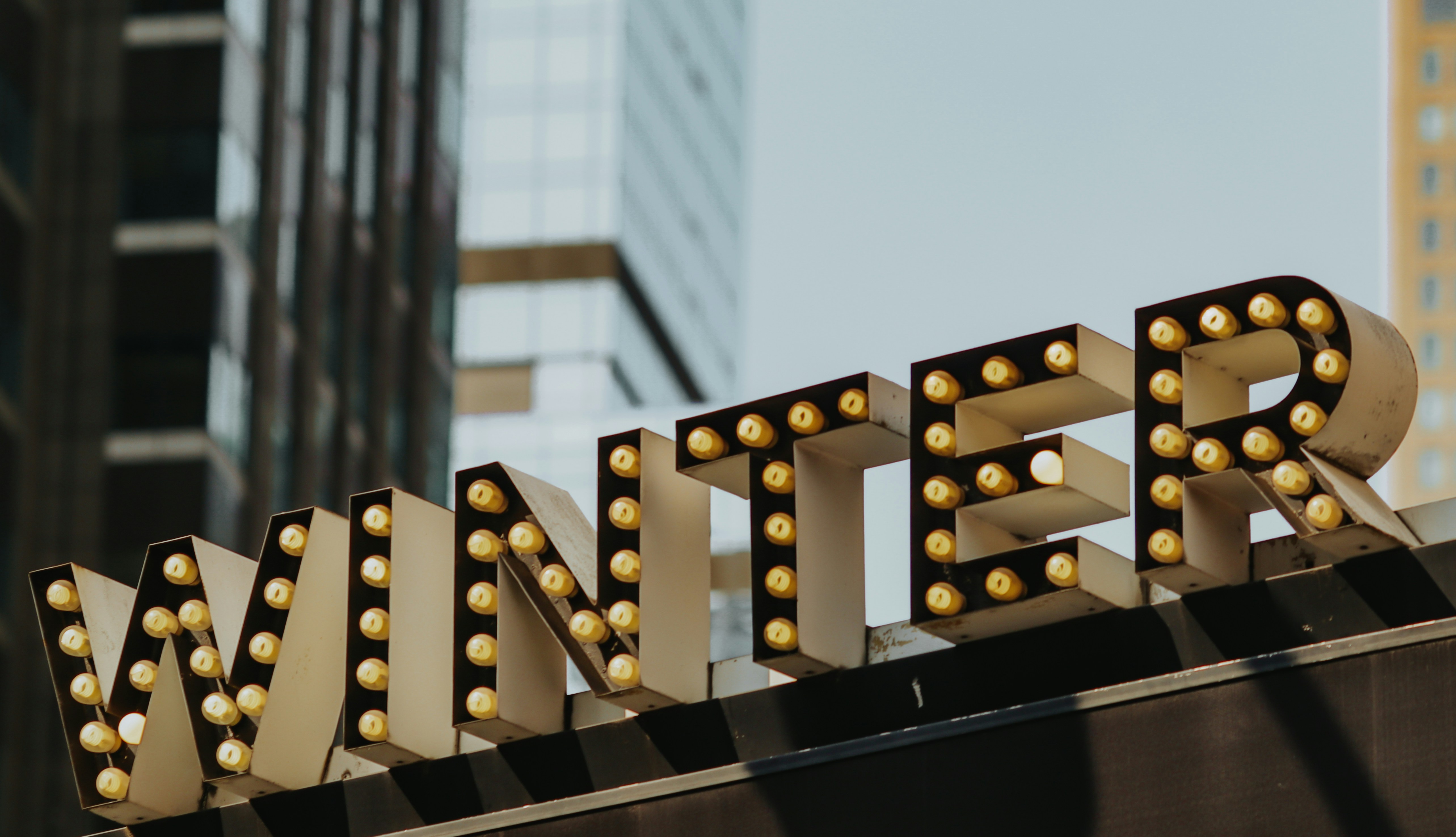 Winter sign illuminated with bulbs.
