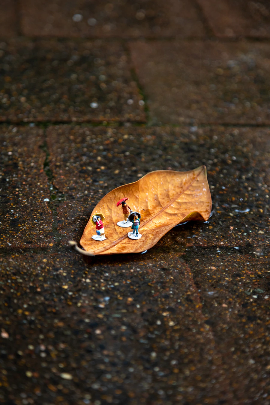 Miniature figures in a cinematic rain scene