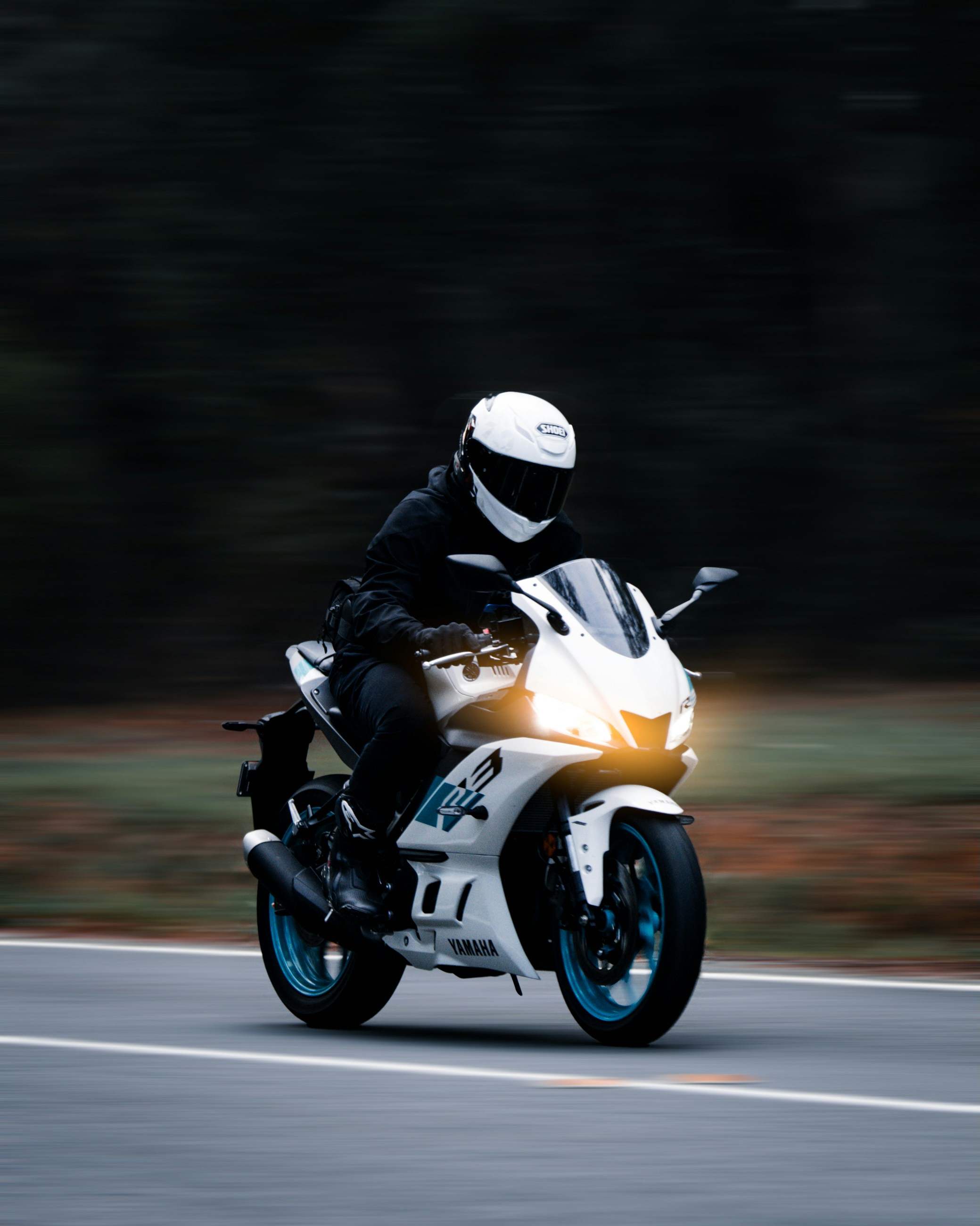 A motorcyclist races down the open road.