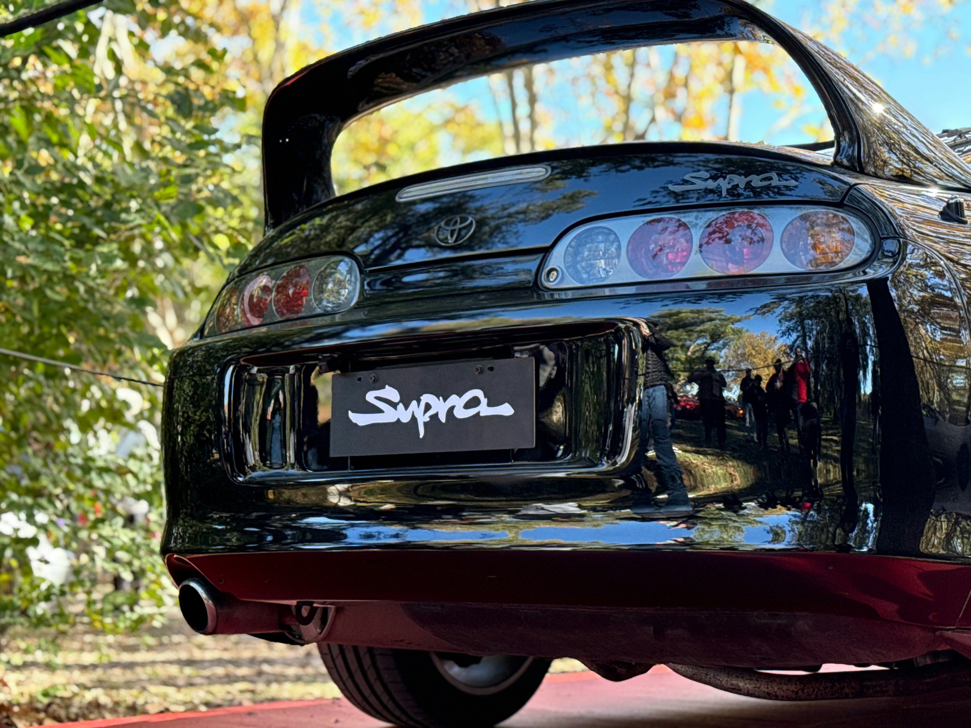A black toyota supra's rear end is shown.