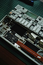 An electronic device is being disassembled.