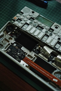 An electronic device is being disassembled.