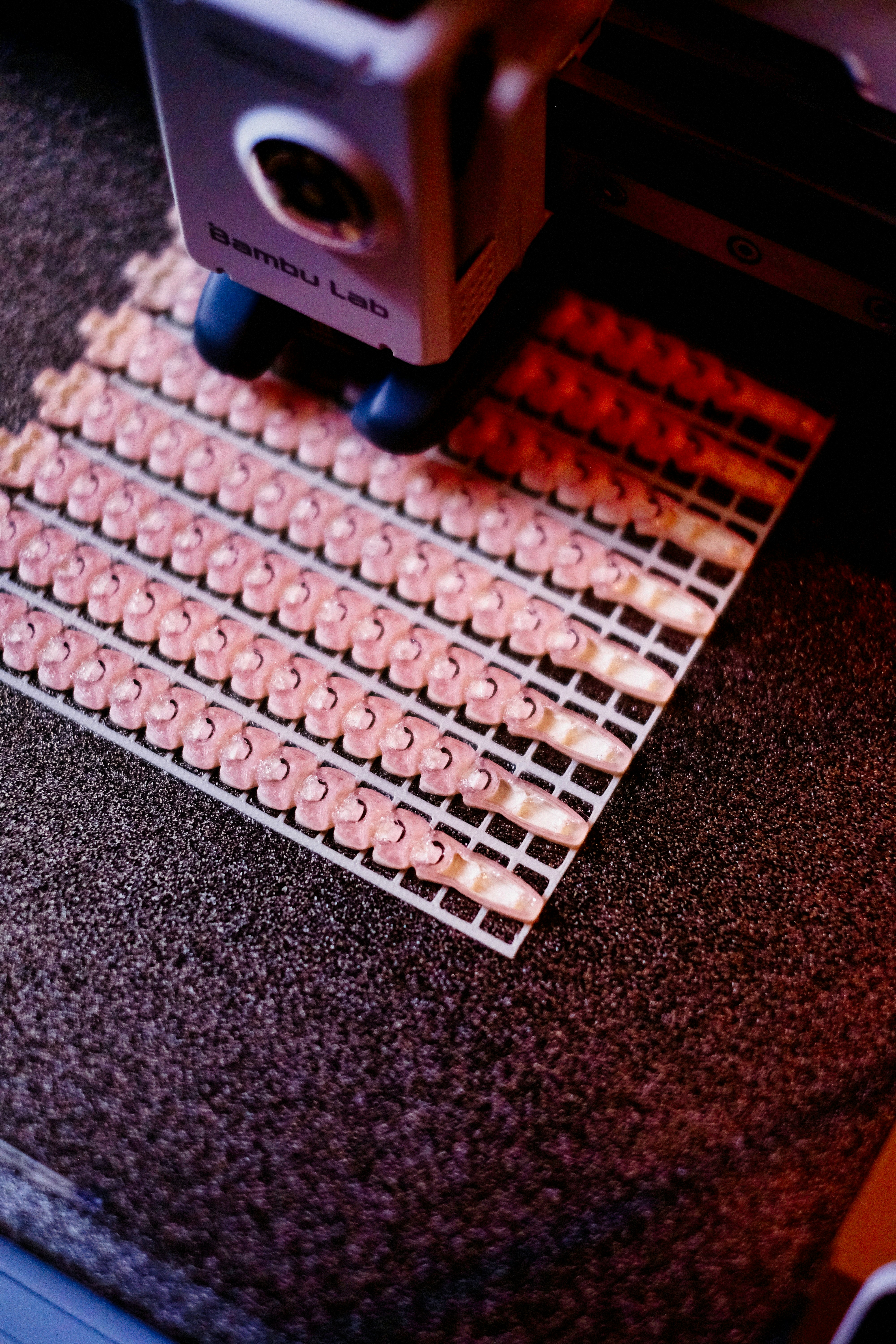 3D printer printing a grid of identical objects