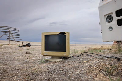 An old computer monitor left out in the open.