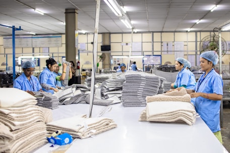 Workers are assembling textiles at a factory.